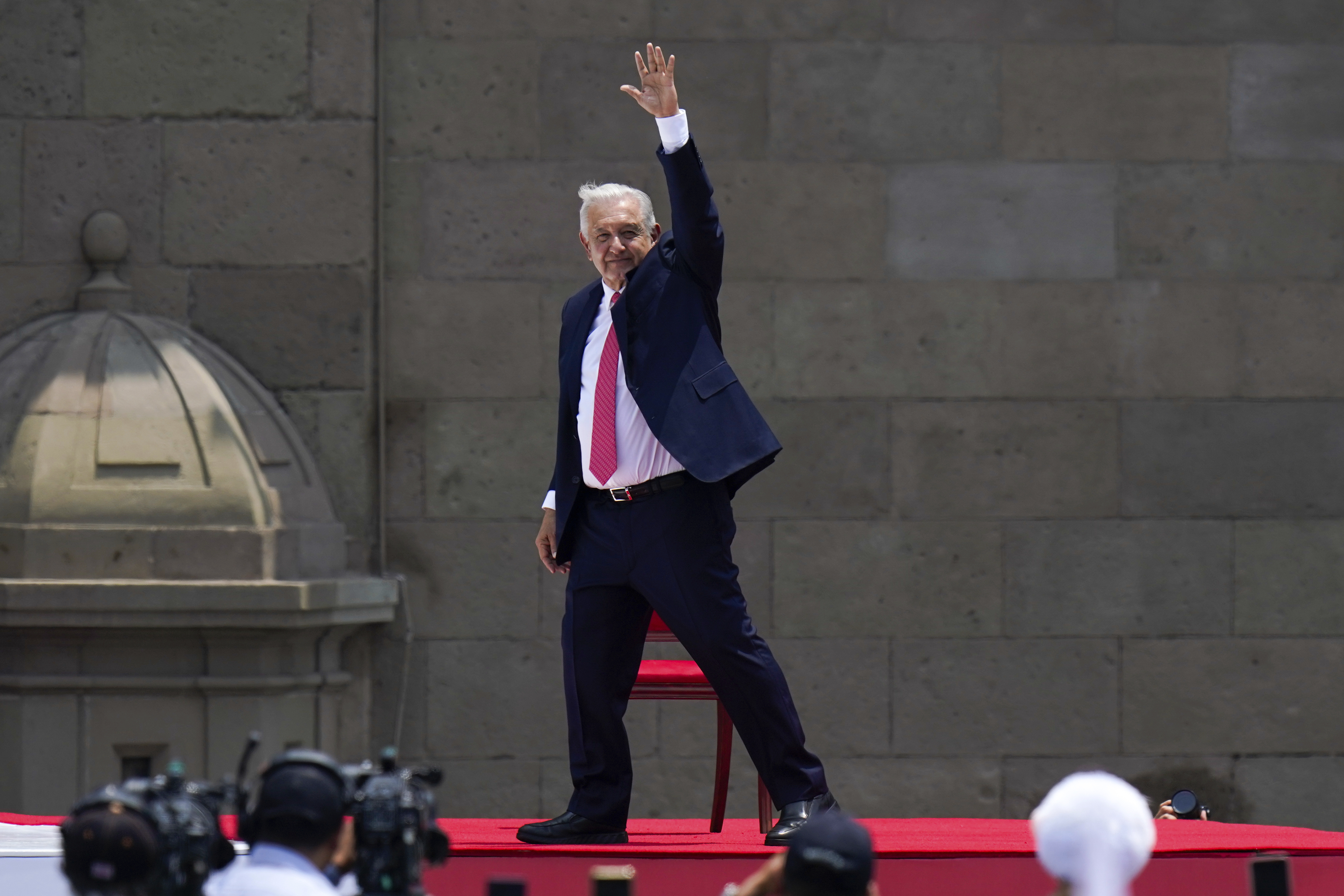 Outgoing President Andres Manuel Lopez Obrador waves after delivering his last State of the Union at the Zocalo, Mexico City's main square, Sunday, Sept. 1, 2024. (AP Photo/Felix Marquez)