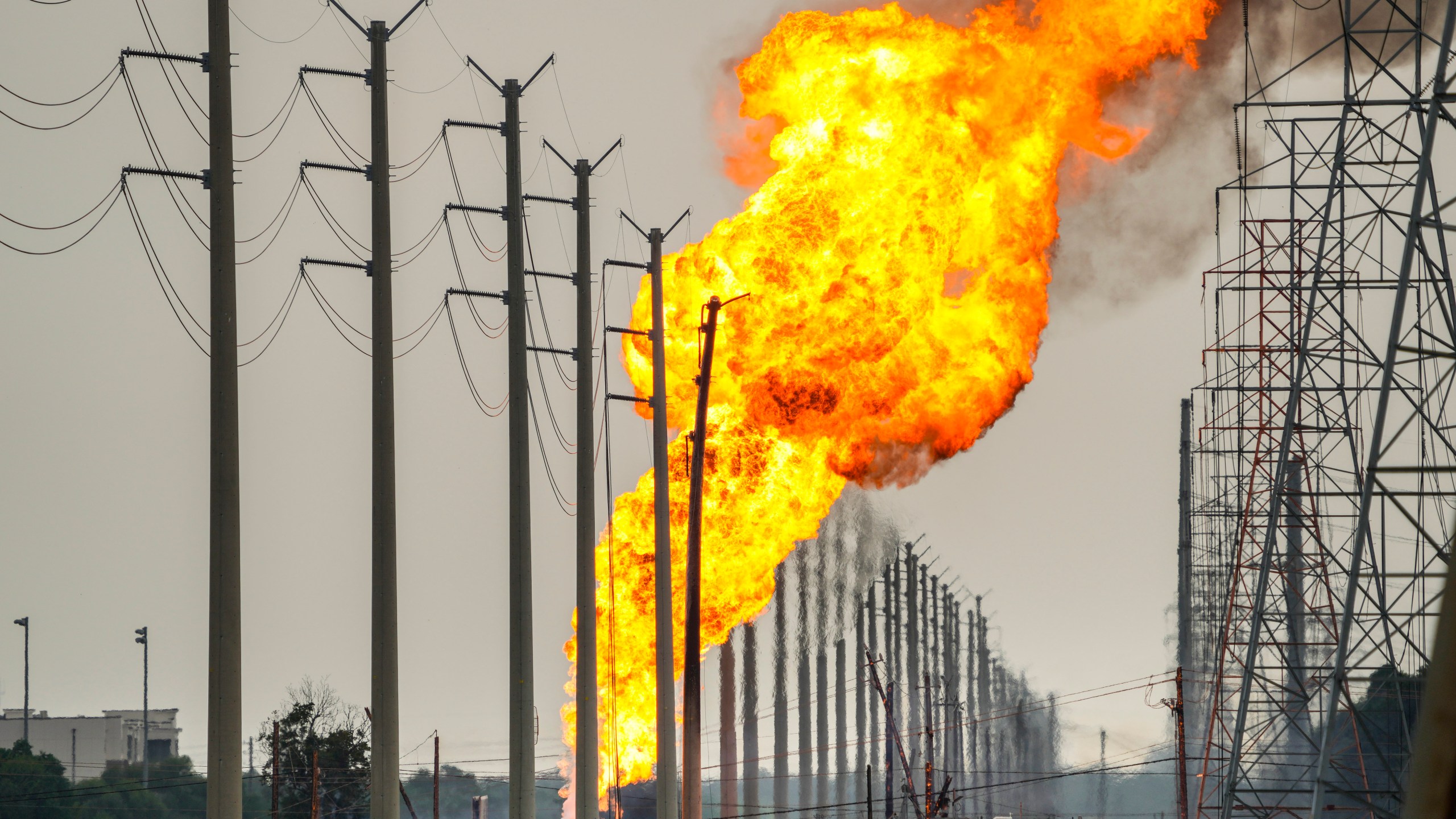 A pipeline carrying liquified natural gas burns near Spencer Highway and Summerton on Monday, Sept. 16, 2024, in La Porte, Texas. (Brett Coomer/Houston Chronicle via AP)