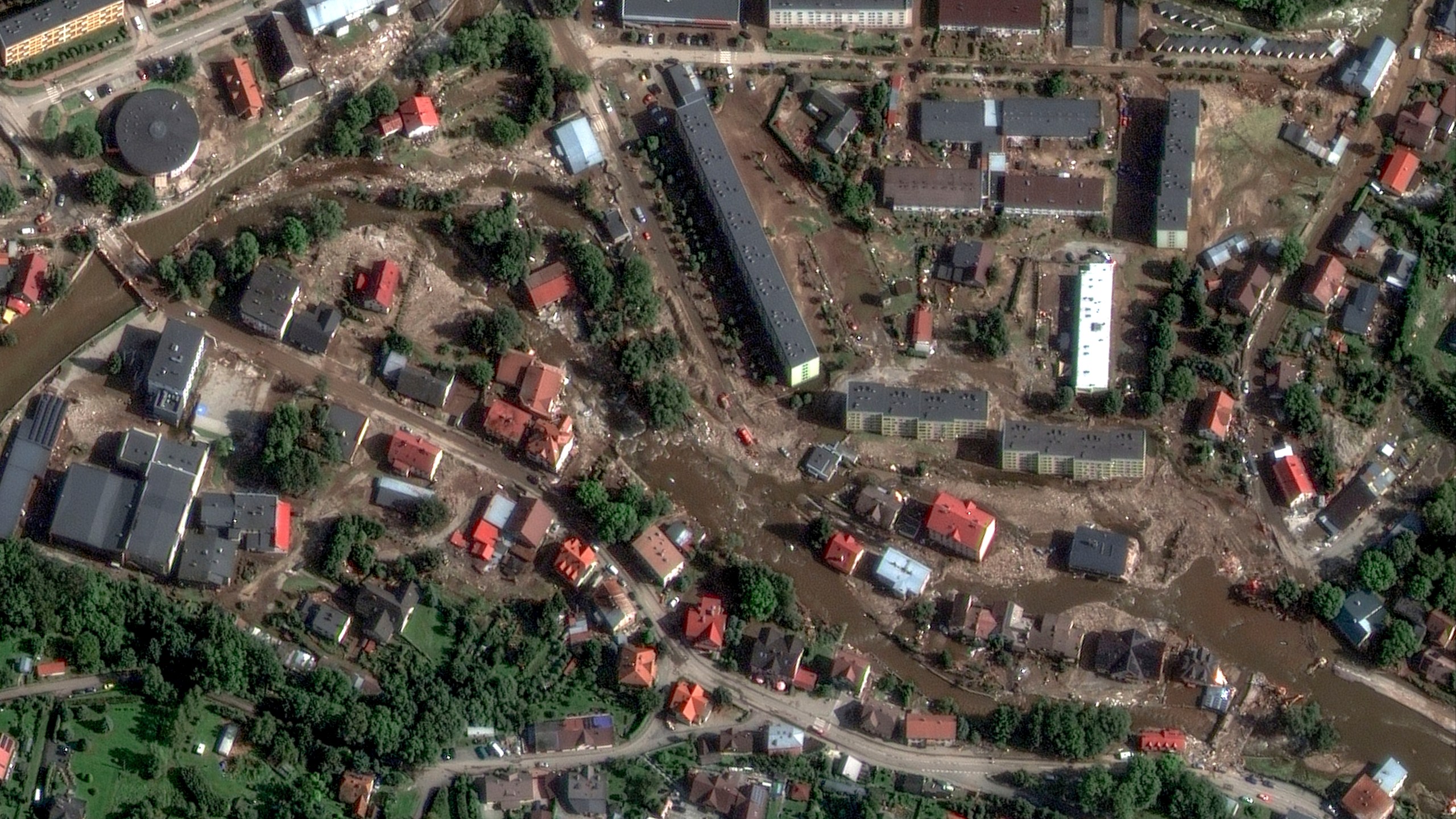 This satellite image released by Maxar Technologies shows debris and mud after heavy rains and flooding in Stronie Slaskie, Poland, Tuesday, Sept. 17, 2024. (Satellite image ©2024 Maxar Technologies via AP)