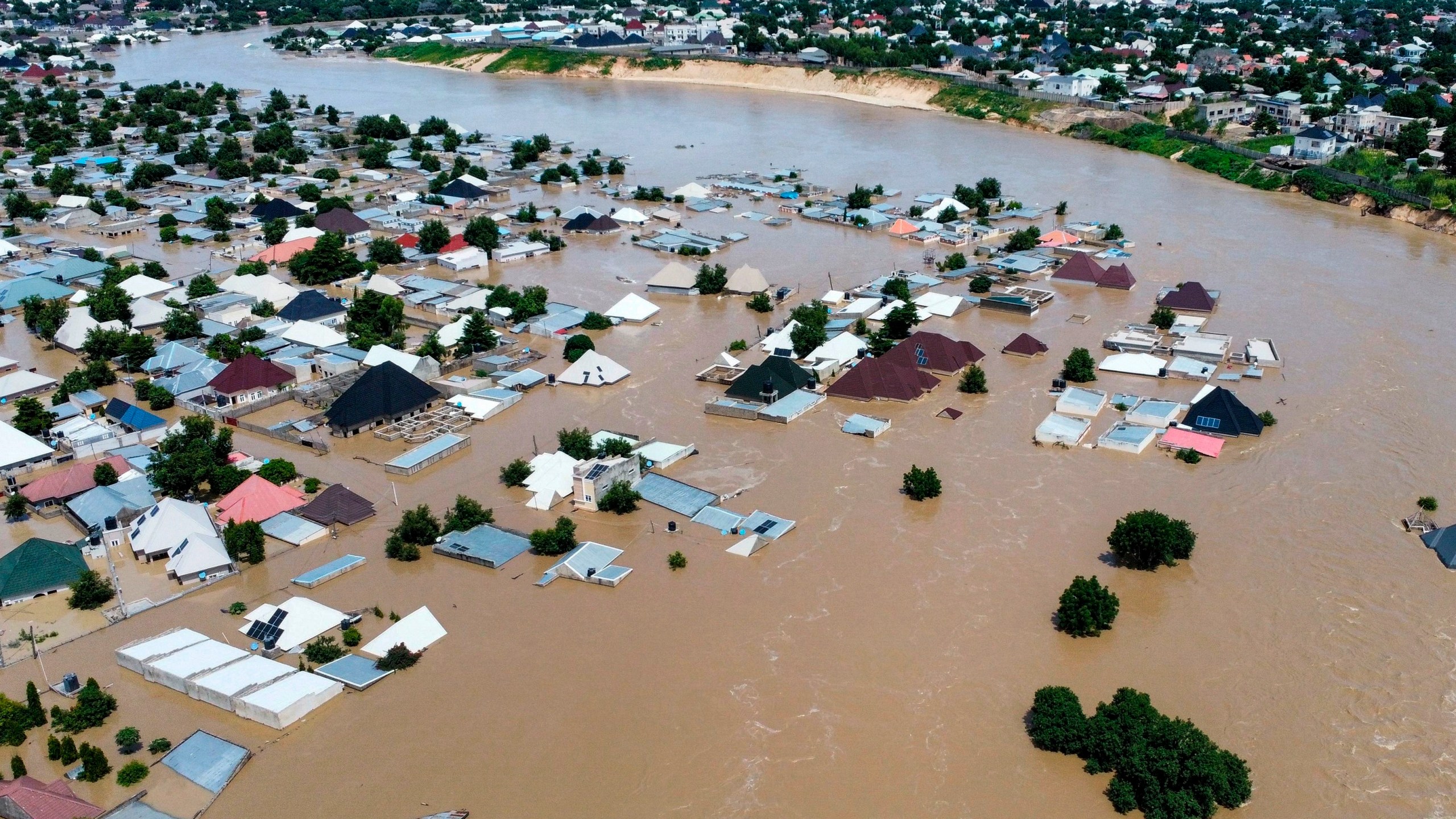 Houses and buildings are partially submerged following a dam collapse in Maiduguri, Nigeria, Tuesday, Sept 10, 2024. (AP Photos/ Musa Ajit Borno)