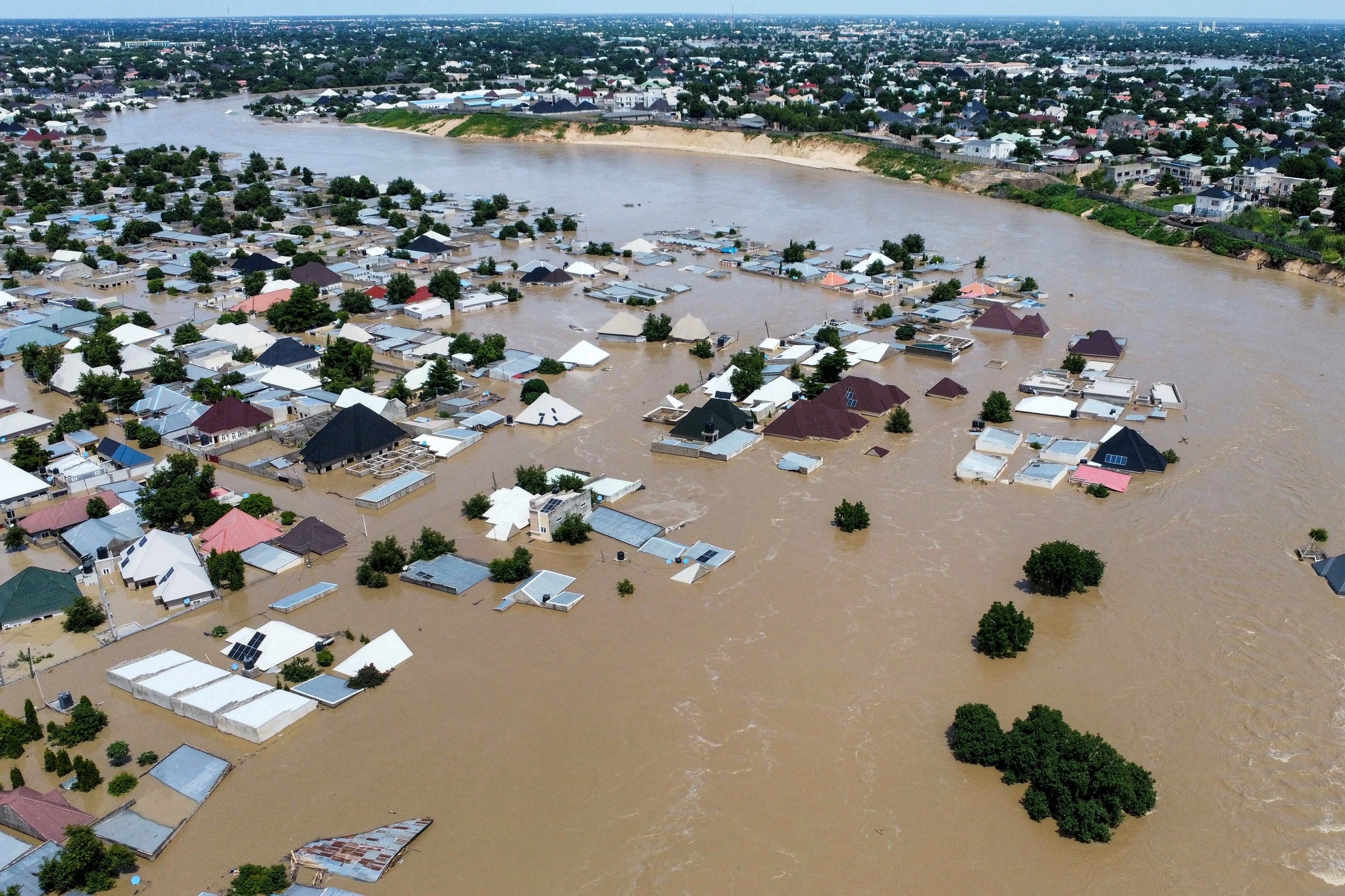 Houses and buildings are partially submerged following a dam collapse in Maiduguri, Nigeria, Tuesday, Sept 10, 2024. (AP Photos/ Musa Ajit Borno)