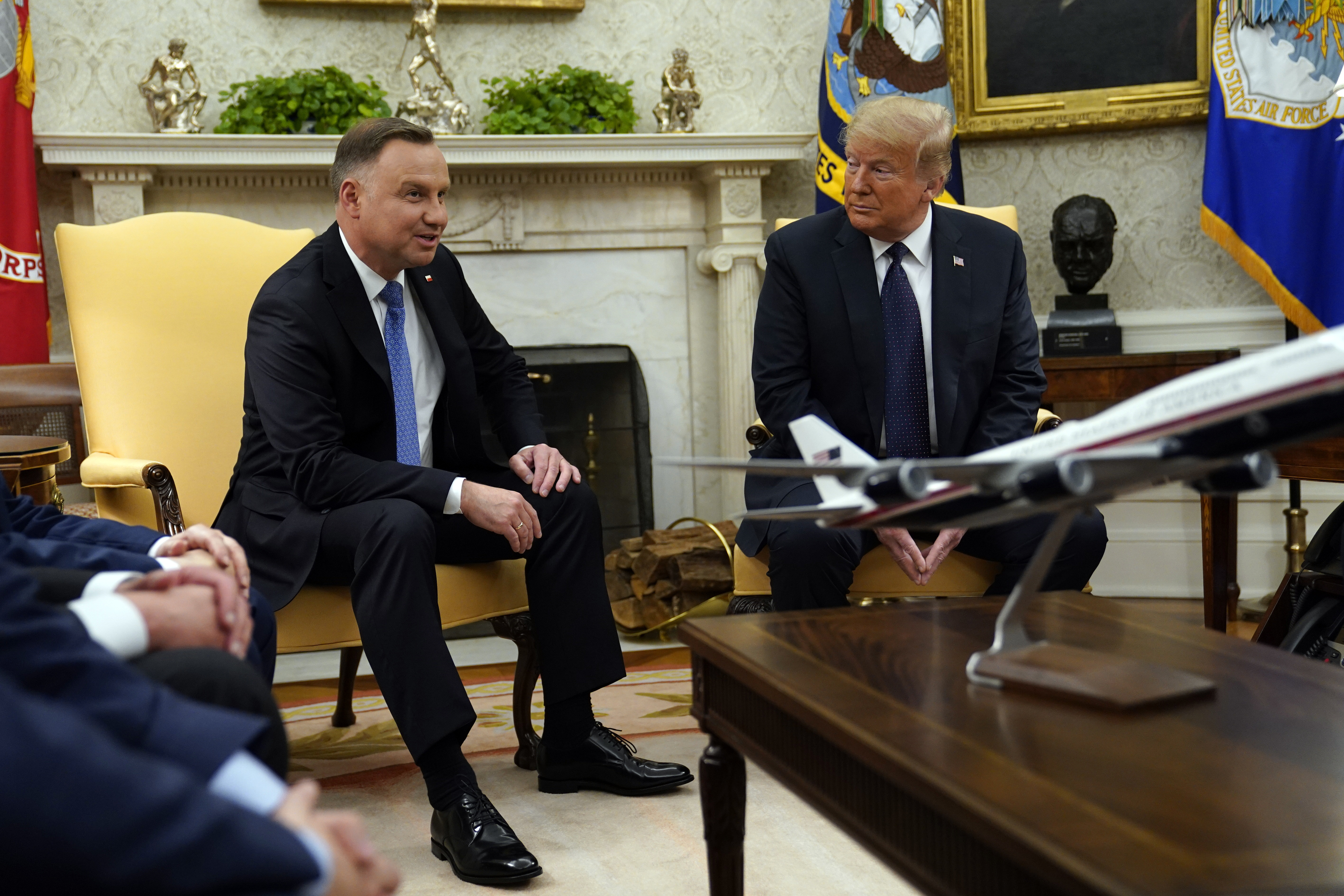 FILE - Then-President Donald Trump meets with Polish President Andrzej Duda in the Oval Office of the White House, June 24, 2020, in Washington. (AP Photo/Evan Vucci, File)