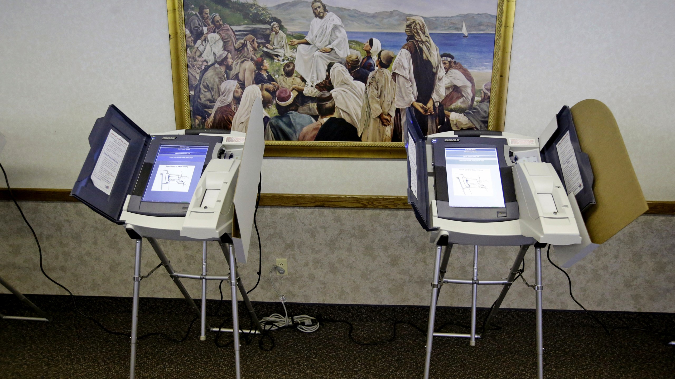 FILE - The polling station at the Sandy Granite View Church of Jesus Christ of Latter-Day Saints is shown, June 24, 2014, in Sandy, Utah. Vice President Kamala Harris is stepping up her efforts to win over voters who belong to the Church of Jesus Christ of Latter-day Saints, enlisting prominent members of the faith to make the case in the battleground state of Arizona that Donald Trump doesn’t align with the church’s values. Harris’ Arizona campaign on Thursday unveiled its Latter-day Saints for Harris-Walz Advisory Committee to formalize its work to engage current and former members of the church, widely known as the Mormon church. (AP Photo/Rick Bowmer, File)