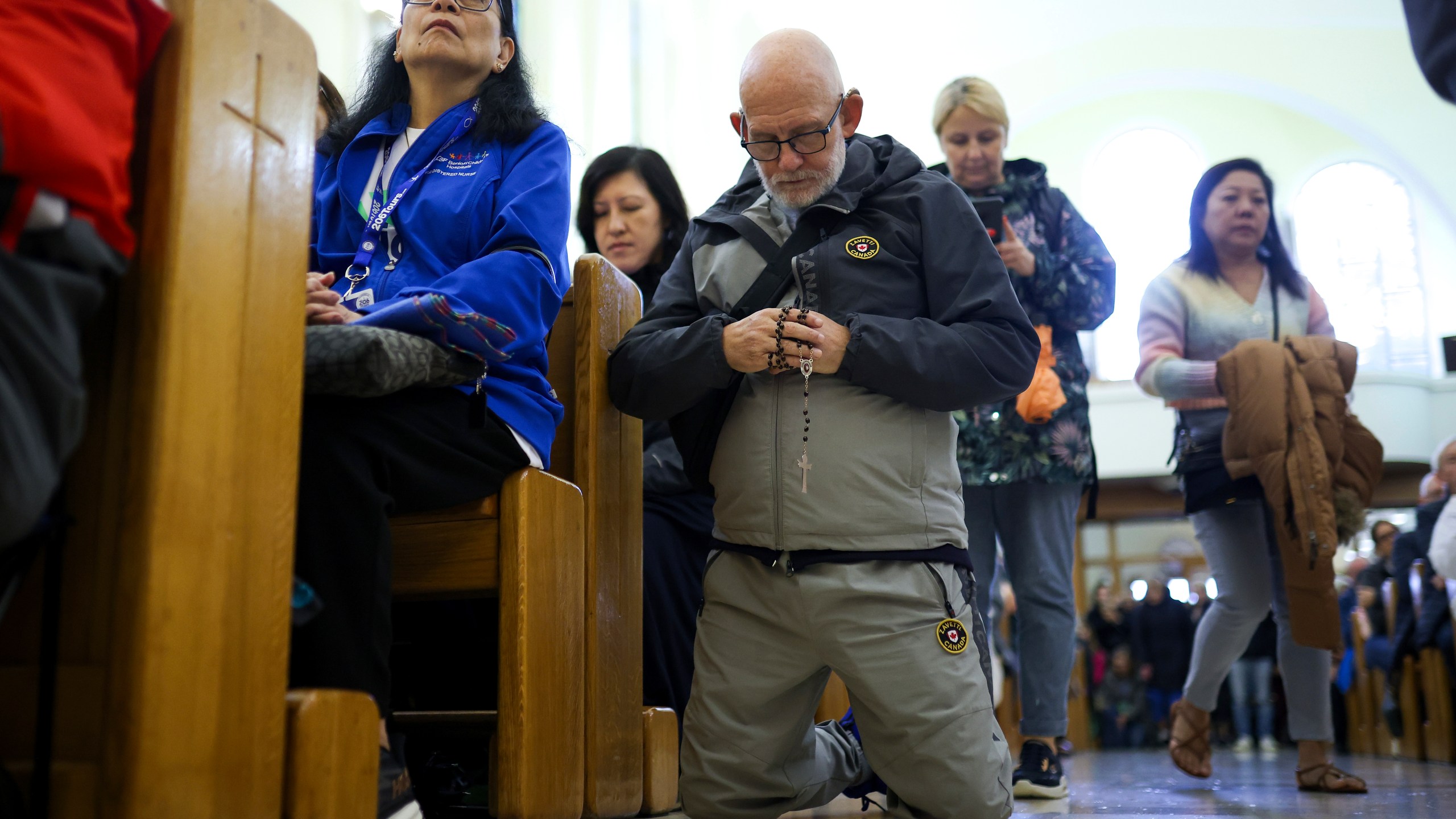 Pilgrims say their prayers inside the St. James Church in Medjugorje, Bosnia, Thursday, Sept. 19, 2024. (AP Photo/Armin Durgut)