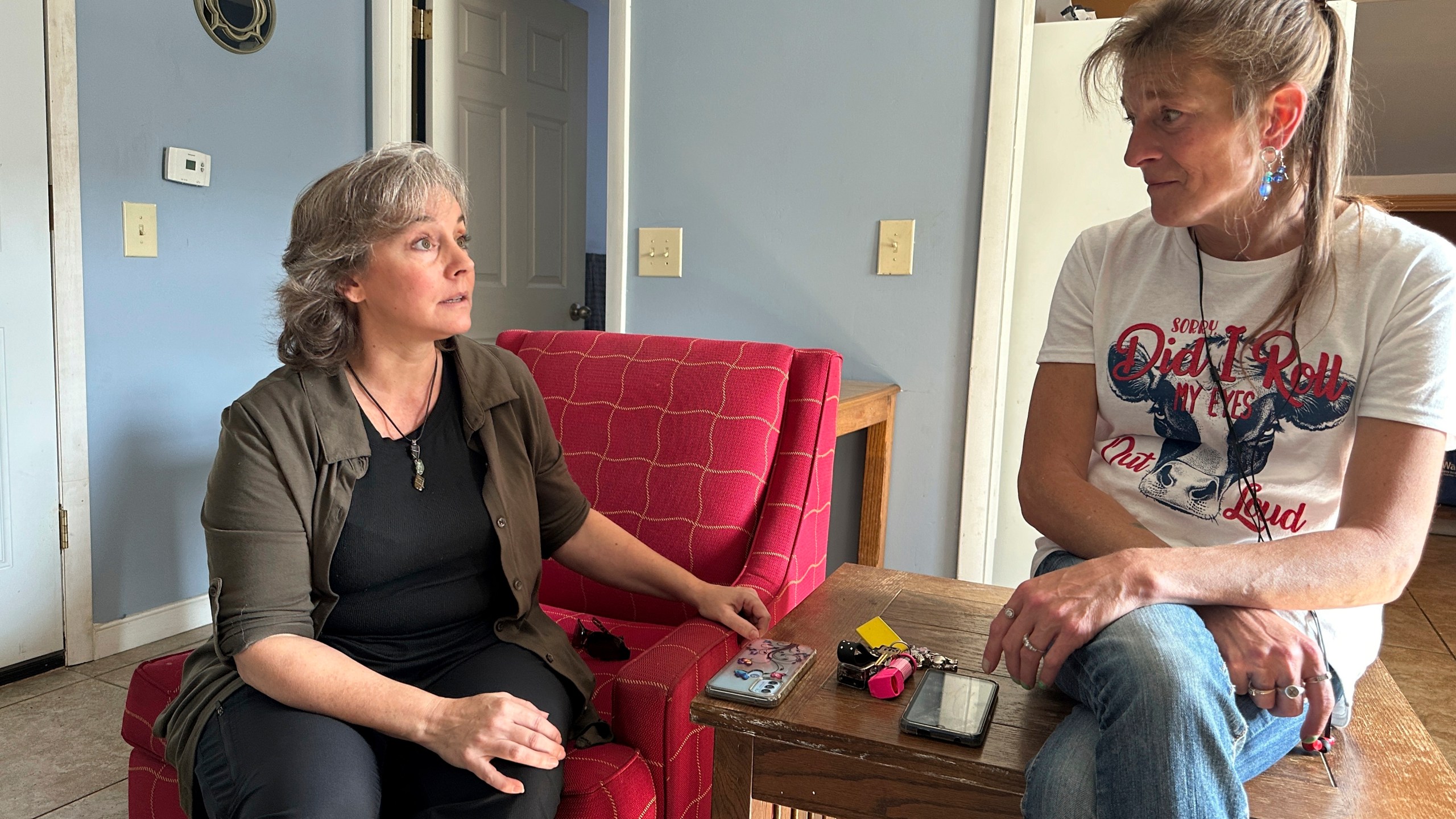 Heidi Wright, right, who is experiencing homelessness and must leave her state-funded motel room by Sept. 28, 2024, talks to Jen Armbrister, an outreach case manager for the Good Samaritan Haven in Barre, Vt., on Wednesday, Sept. 18, 2024. (AP Photo/Lisa Rathke)