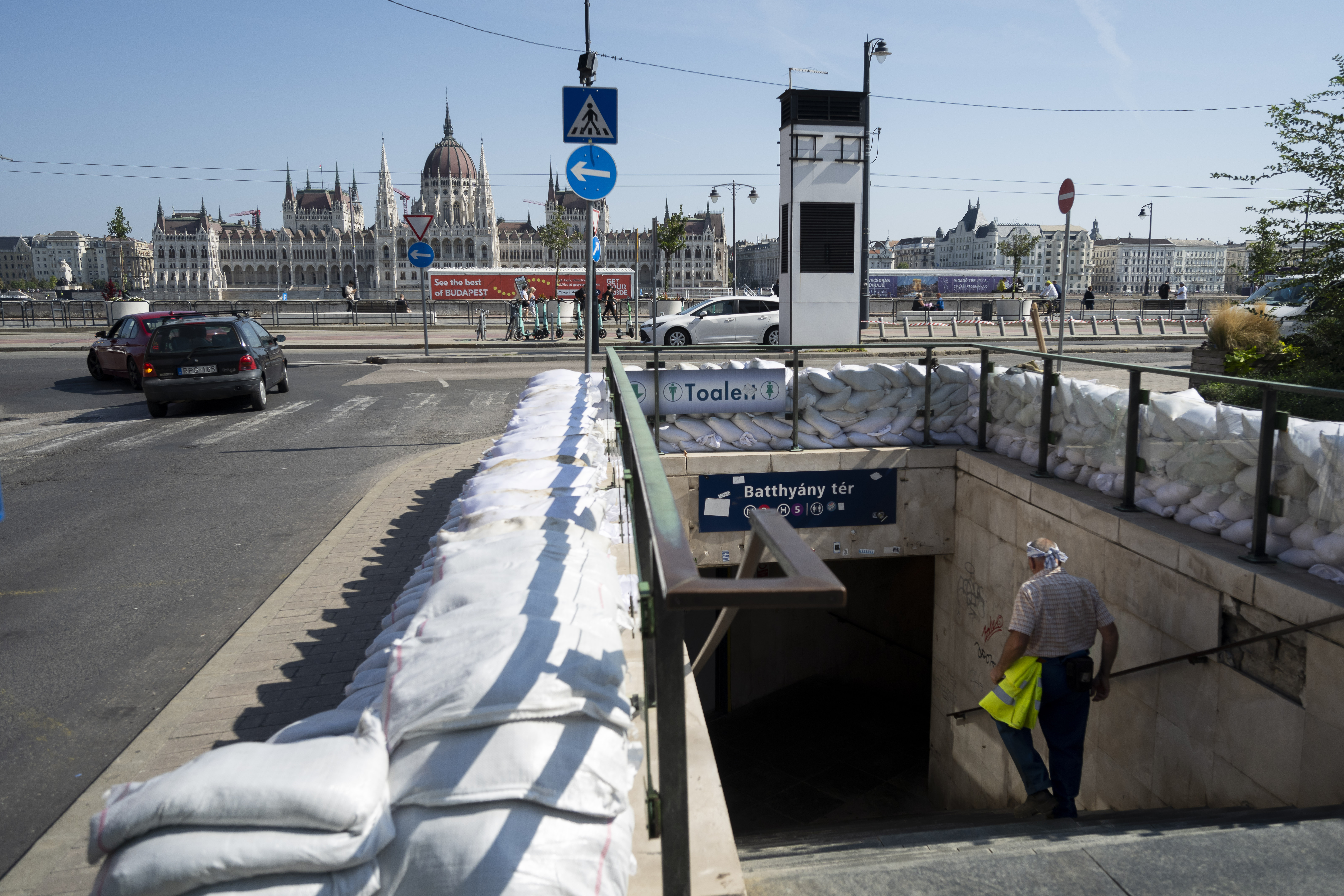 A workers walks down to a metro station protected by sandbags as the Danube river floods it's banks, central Budapest, Hungary, Thursday, Sept. 19, 2024. (AP Photo/Denes Erdos)