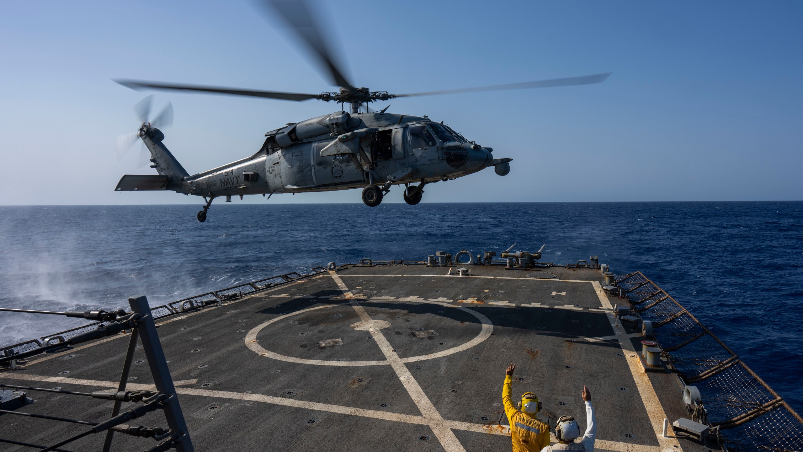 FILE - An HSC-7 helicopter lands on the Arleigh Burke-class guided missile destroyer USS Laboon in the Red Sea, June 12, 2024. (AP Photo/Bernat Armangue, File)