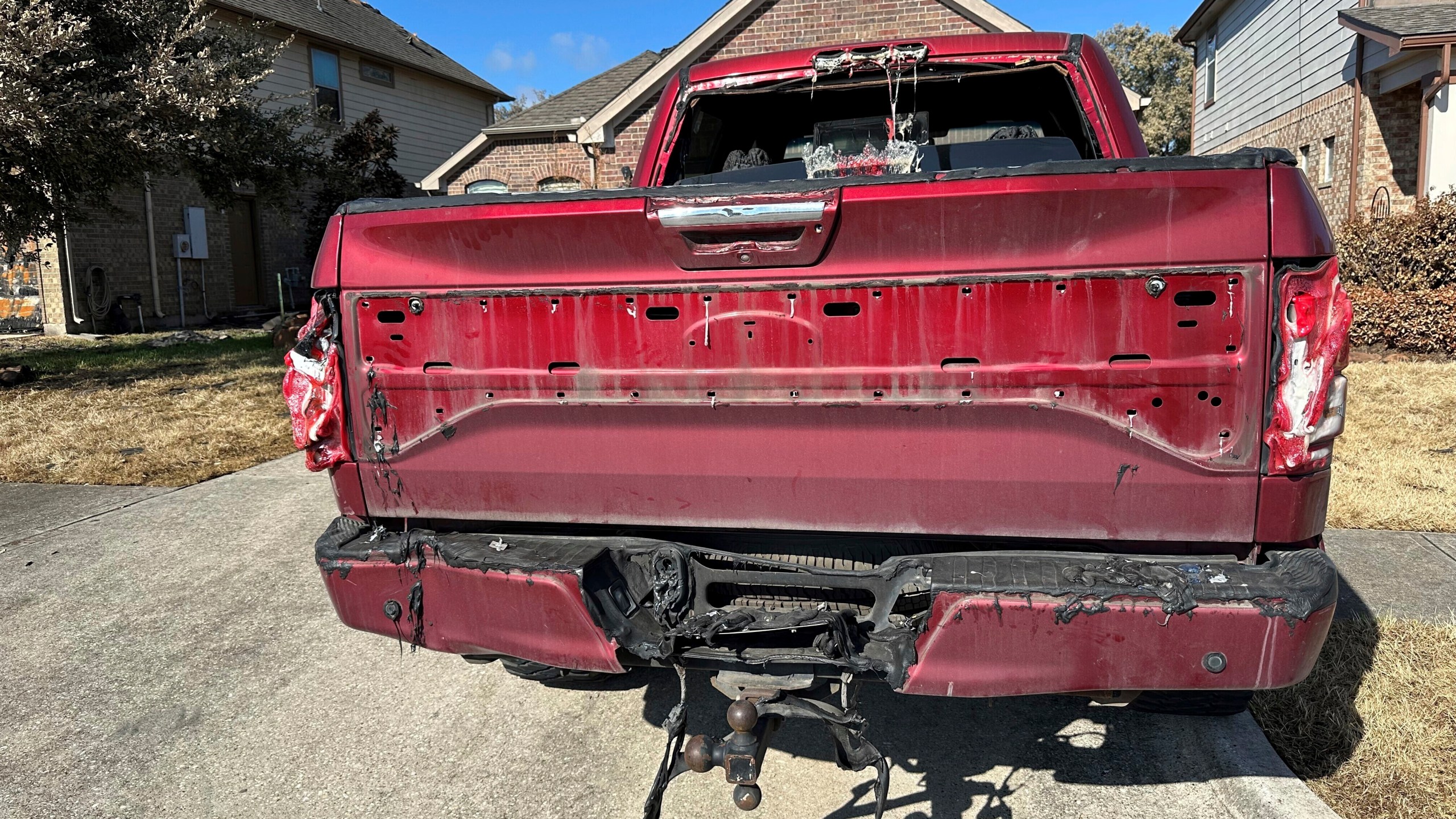 A truck that had parts of its equipment melted by the heat of a pipeline fire sits in the driveway of a home in Deer Park, Texas, on Thursday, Sept. 19, 2024. (AP Photo/Juan A. Lozano)(AP Photo/Juan A. Lozano)