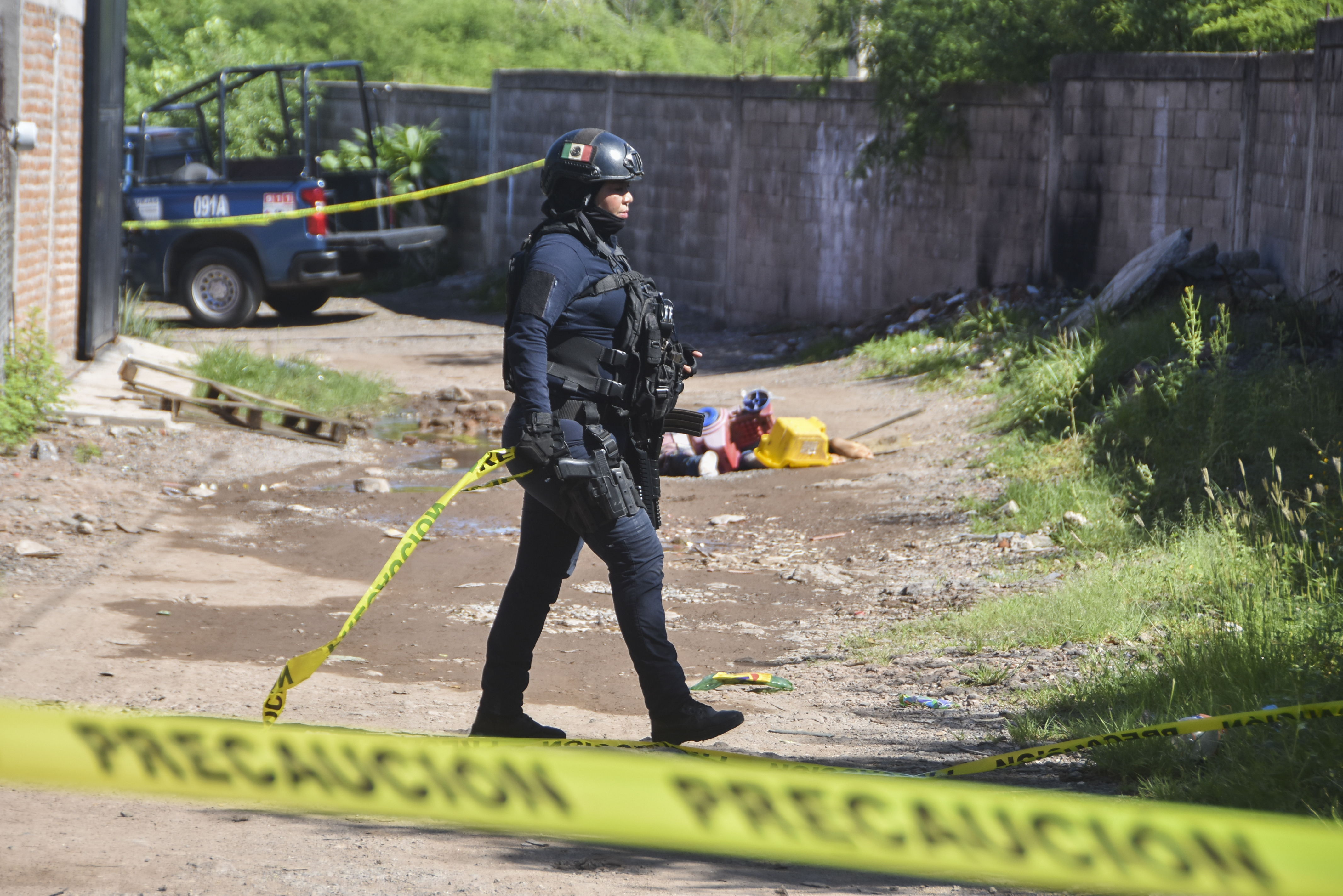 Police work in the area where bodies lie on the ground in Culiacan, Sinaloa state, Mexico, Tuesday, Sept. 17, 2024. (AP Photo)