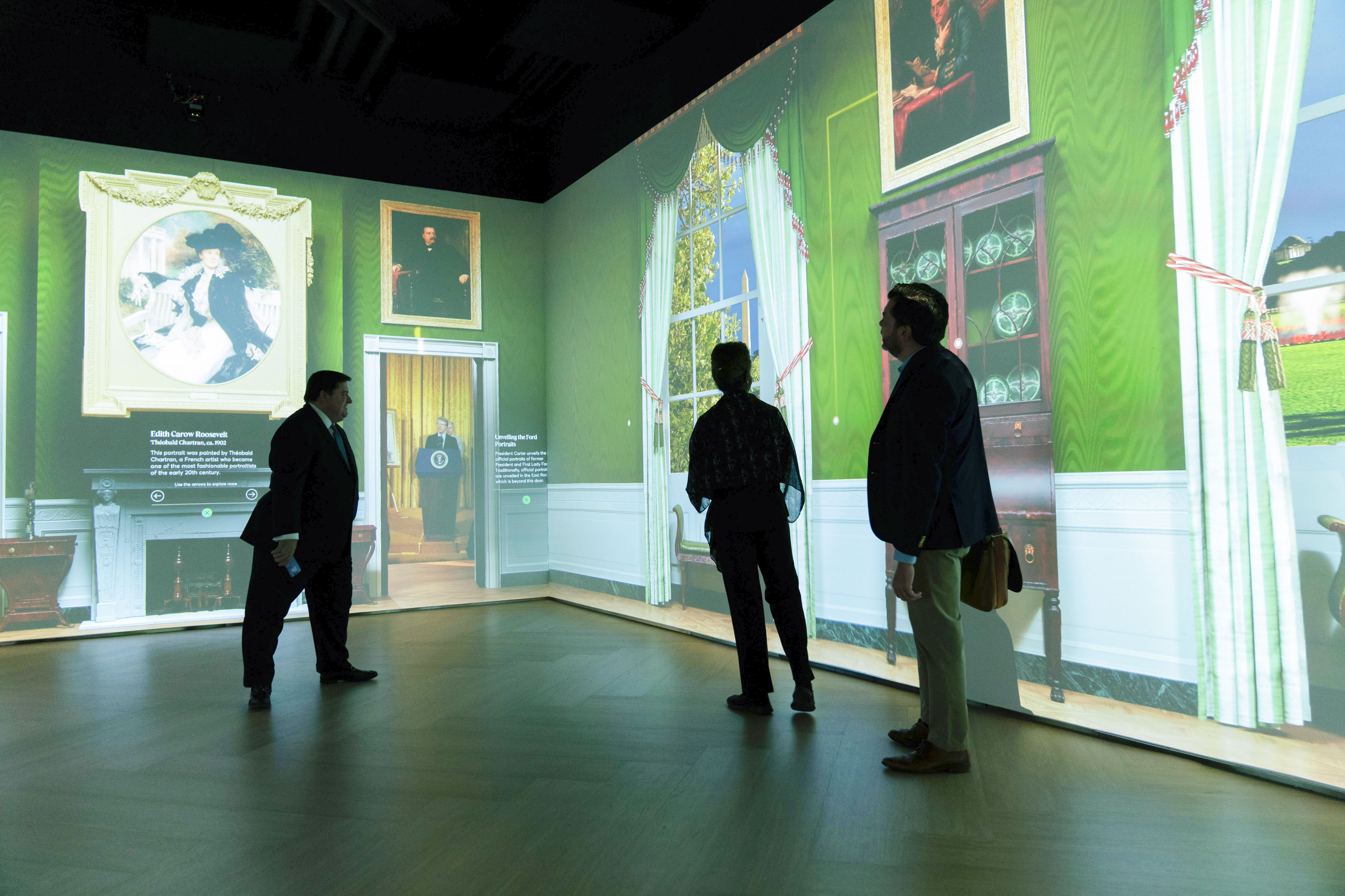 White House Historical Association President Stewart McLaurin tour members of the media in an interactive 3D room of the White House Green Room as is today, shown at The People's House exhibit, Monday, Sept. 16, 2024 in Washington. (AP Photo/Jose Luis Magana)