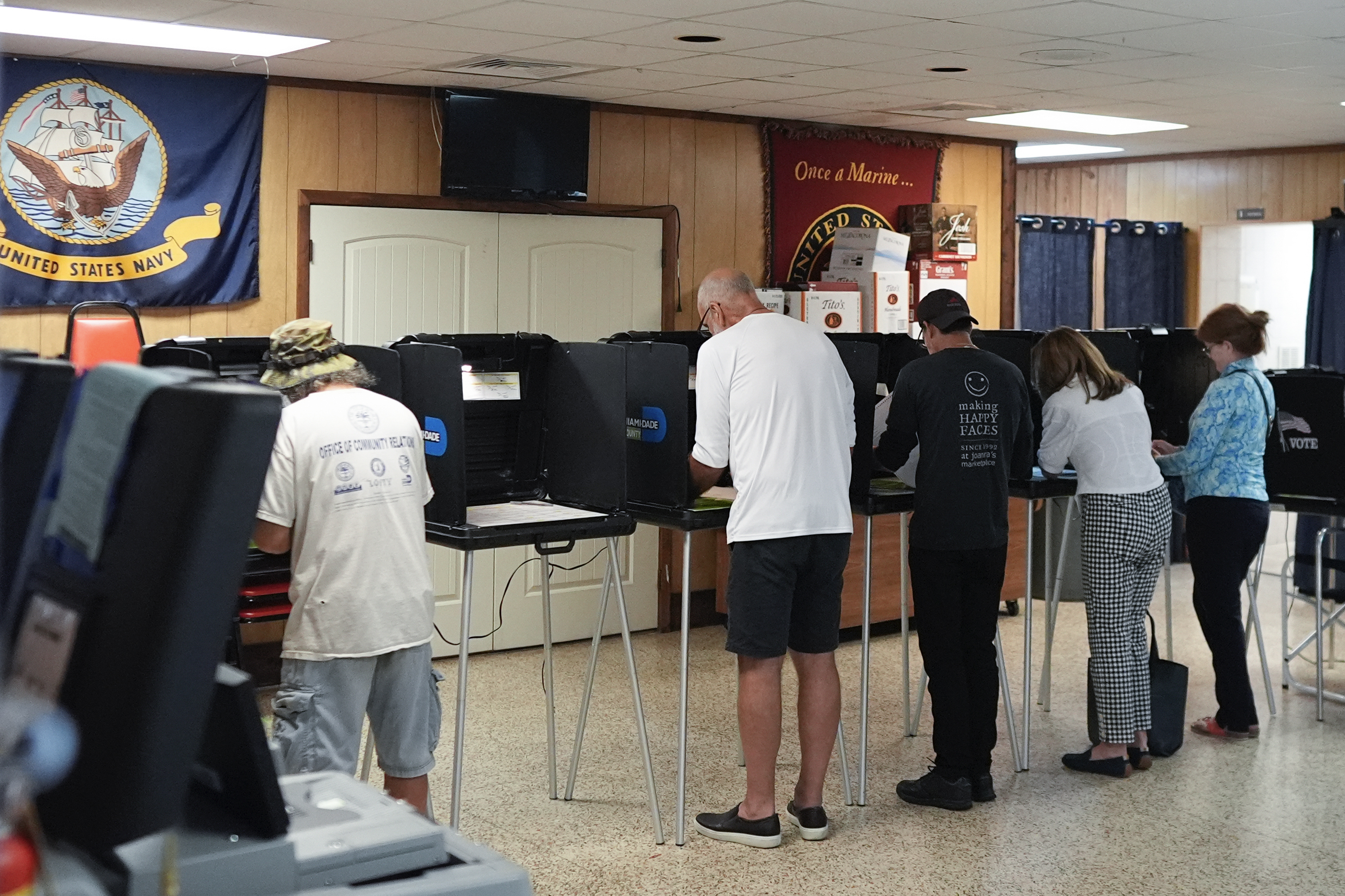 FILE - Voters fill in their ballots for Florida's primary election in South Miami, Fla., Aug. 20, 2024. (AP Photo/Rebecca Blackwell, File)