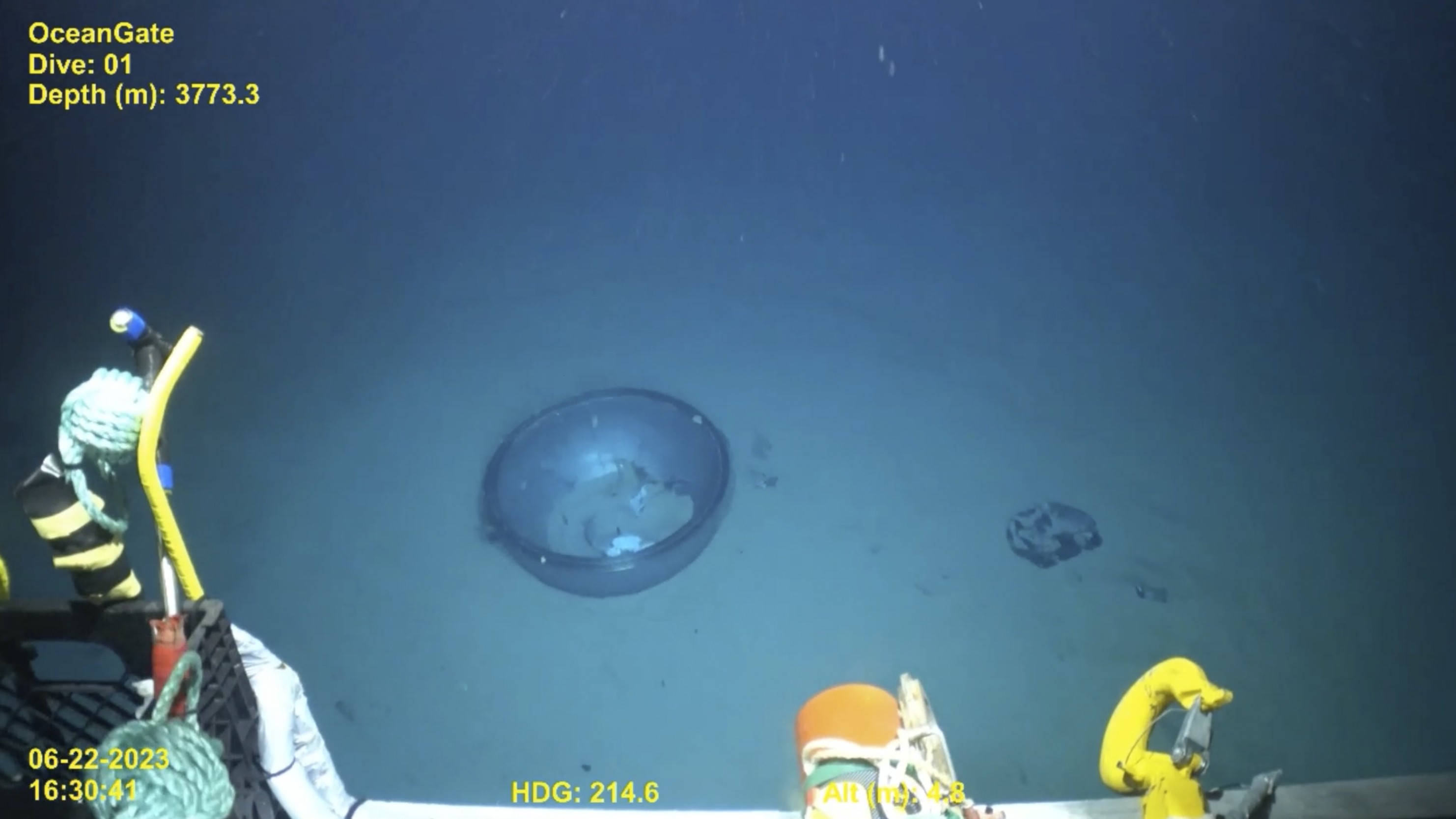 This June 2023 United States Coast Guard still frame from video provided by Pelagic Research Services, shows remains of the Titan submersible, center, on the floor of the Atlantic Ocean. (U.S. Coast Guard Video courtesy Pelagic Research Services via AP)