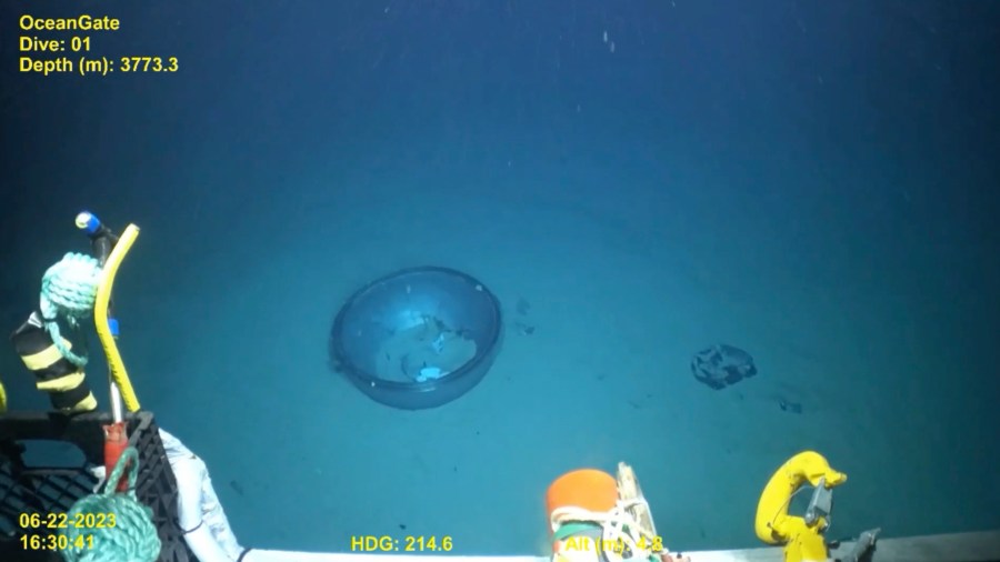 This June 2023 United States Coast Guard still frame from video provided by Pelagic Research Services, shows remains of the Titan submersible, center, on the floor of the Atlantic Ocean. (U.S. Coast Guard Video courtesy Pelagic Research Services via AP)