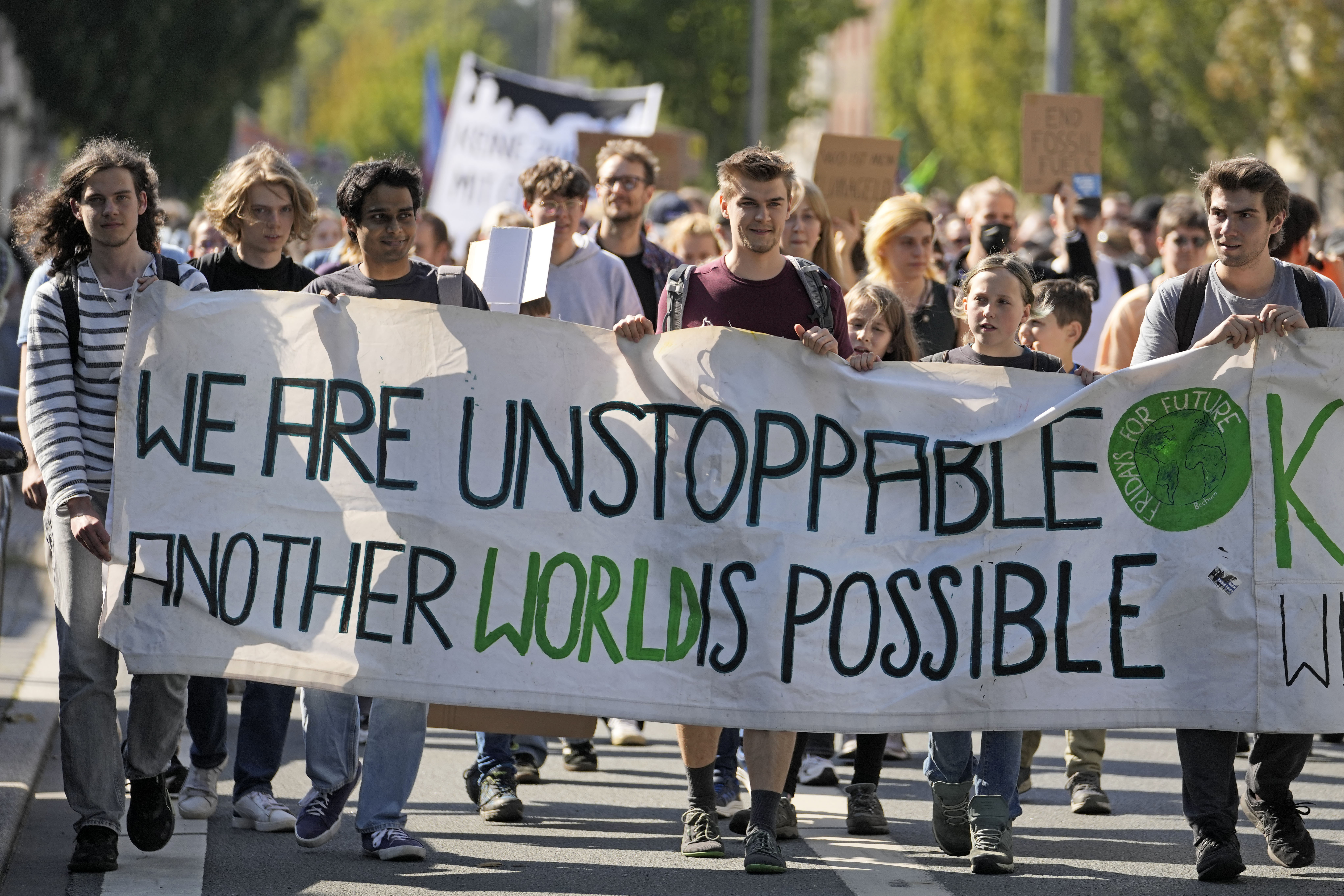 People demonstrate in the City of Bochum, western Germany, as they take part in a Global Climate Strike protest of the Fridays For Future movement on Friday, Sept. 20, 2024. (AP Photo/Martin Meissner)