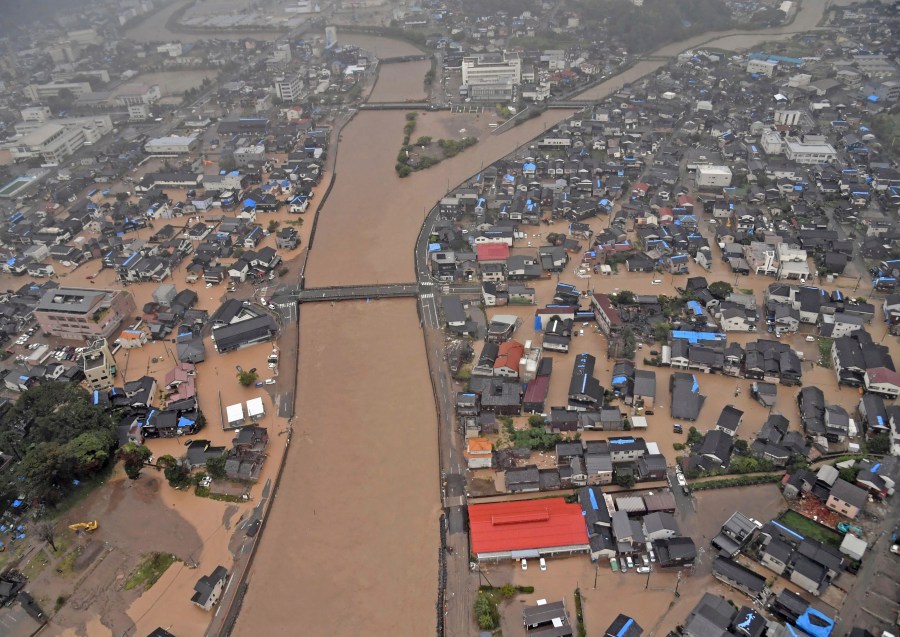 This aerial photo shows the flooded Kawarada river and submerged area after heavy rain in Wajima, Ishikawa prefecture, Saturday, Sept. 21, 2024. (Kyodo News via AP)