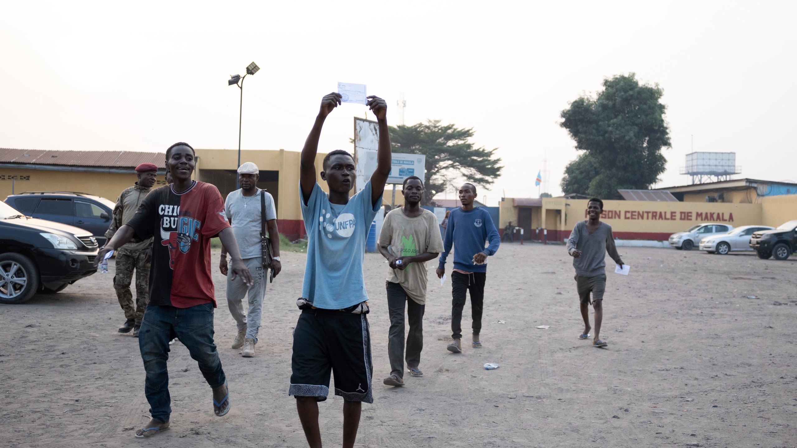 Some of the 600 prisoners released from Democratic Republic of the Congo's capital Kinshasa's Makala Central Prison react Saturday, Sept. 21, 2024. (AP Photo/Samy Ntumba Shambuyi)