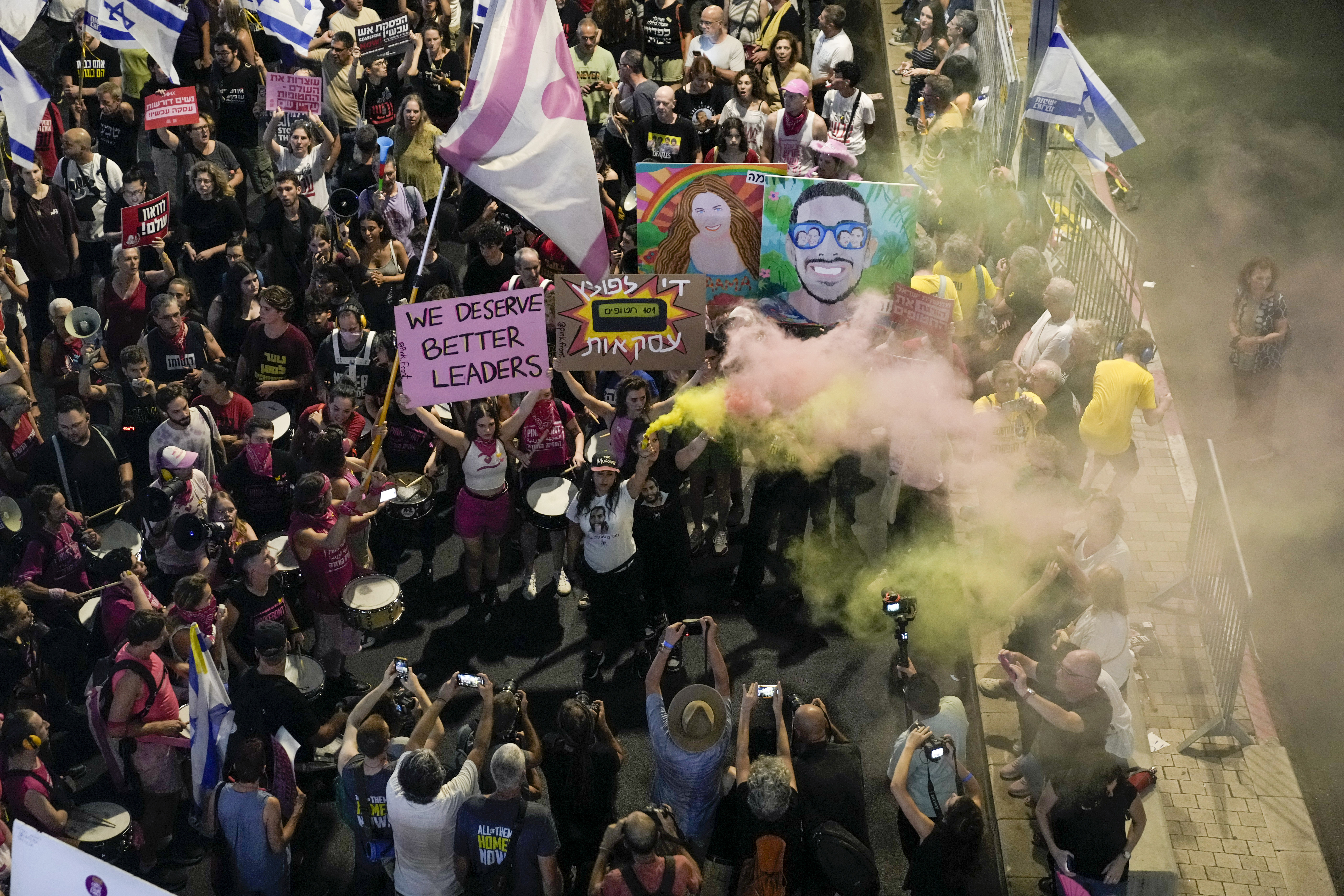 People protest against Prime Minister Benjamin Netanyahu's government and call for the release of hostages held in the Gaza Strip by the Hamas militant group, in Tel Aviv, Israel, Saturday, Sept. 21, 2024. (AP Photo/Mahmoud Illean)