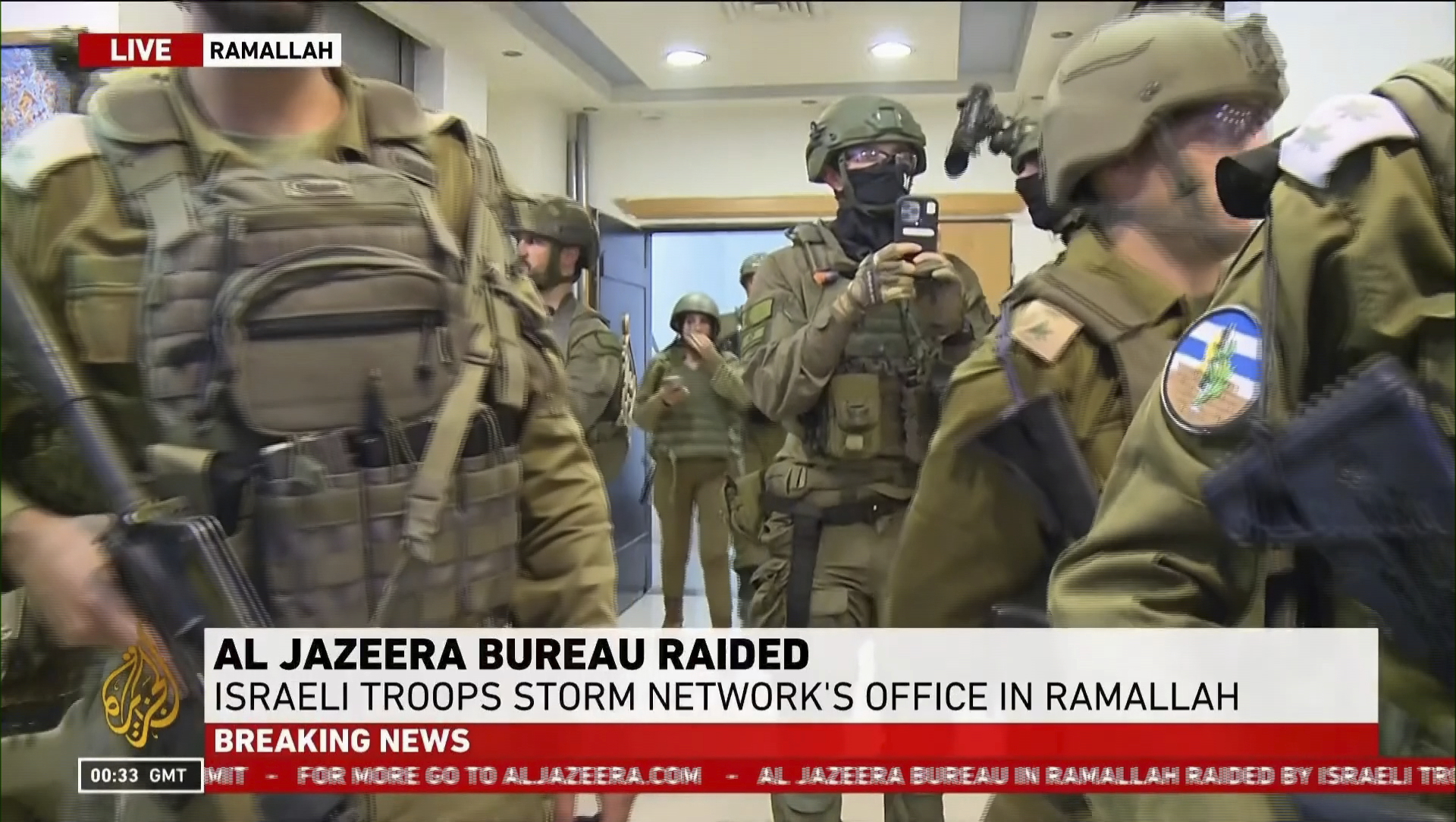 This image made from video provided by Al Jazeera English shows Israeli troops raiding their bureau in Ramallah, West Bank, Sunday, Sept. 22, 2024. (Al Jazeera via AP)