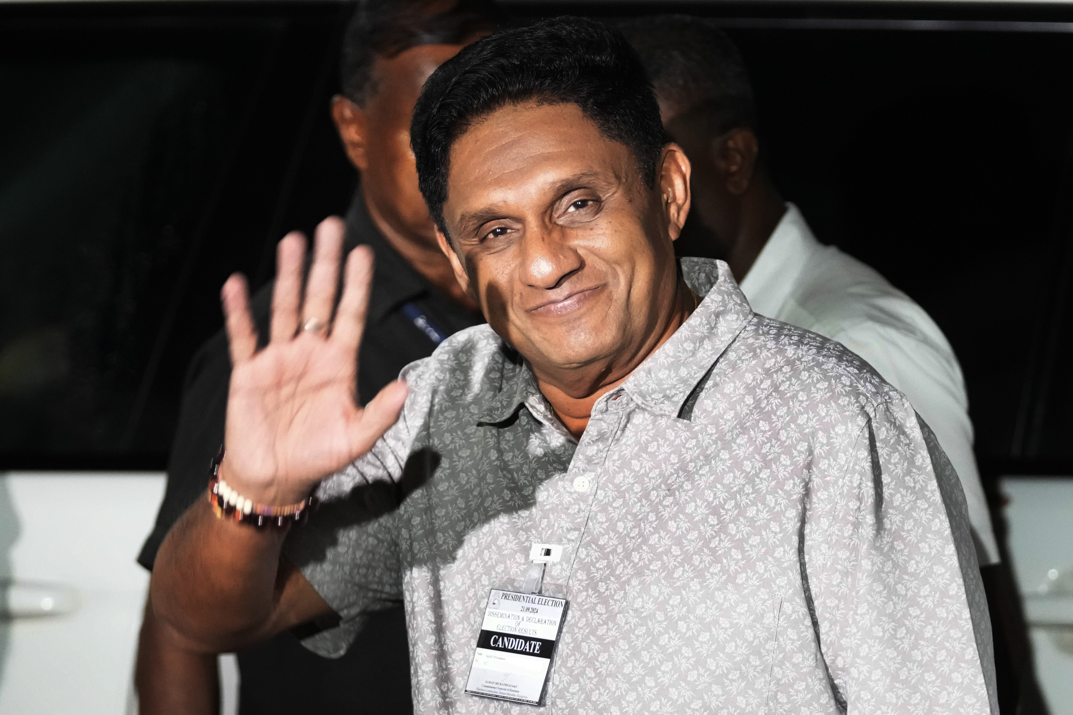 Sri Lankan opposition leader Sajith Premadasa waves as he arrives at the election commission office, in Colombo, Sri Lanka, Sunday, Sept. 22, 2024. (AP Photo/Eranga Jayawardane)