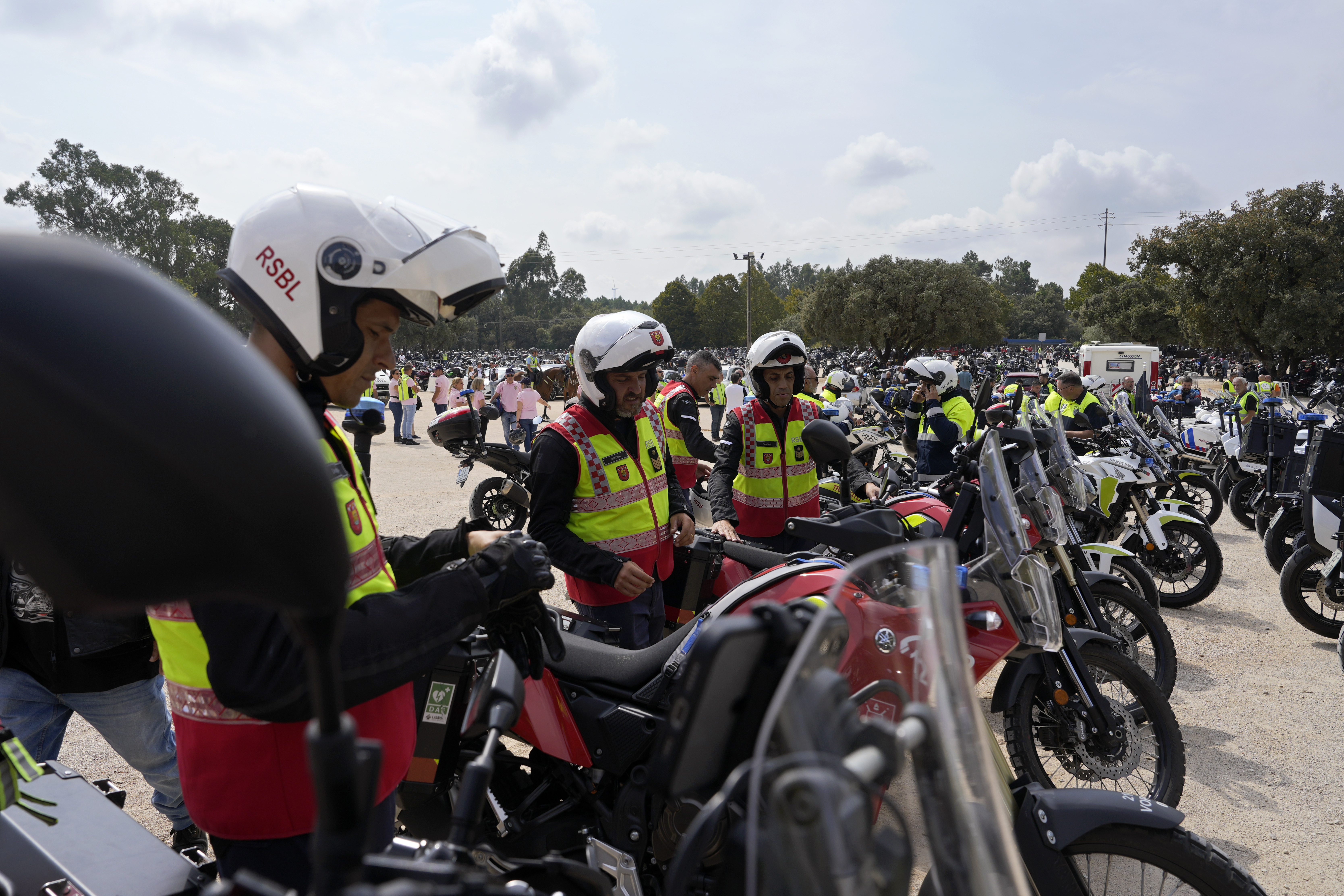 A group of Lisbon firefighters motorcyclists get on their bikes to leave after taking part in the IX Pilgrimage of the Blessing of Helmets that draws tens of thousands to the Roman Catholic holy shrine of Fatima, in Fatima, Portugal, Sunday, Sept. 22, 2024. (AP Photo/Ana Brigida)