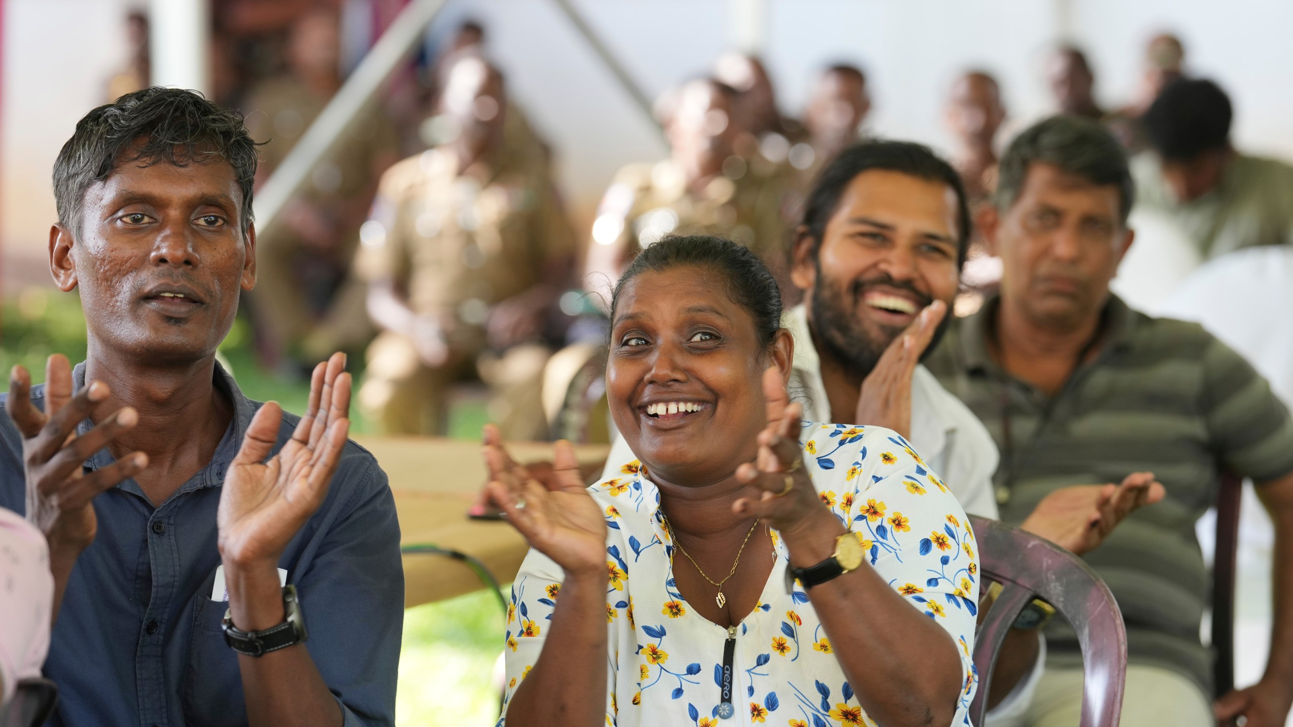 Supporters Marxist lawmaker Anura Kumara Dissanayake cheer as they watch presidential election results on a big electronic screen in Colombo, Sri Lanka, Sunday, Sept. 22, 2024. (AP Photo/Rajesh Kumar Singh)