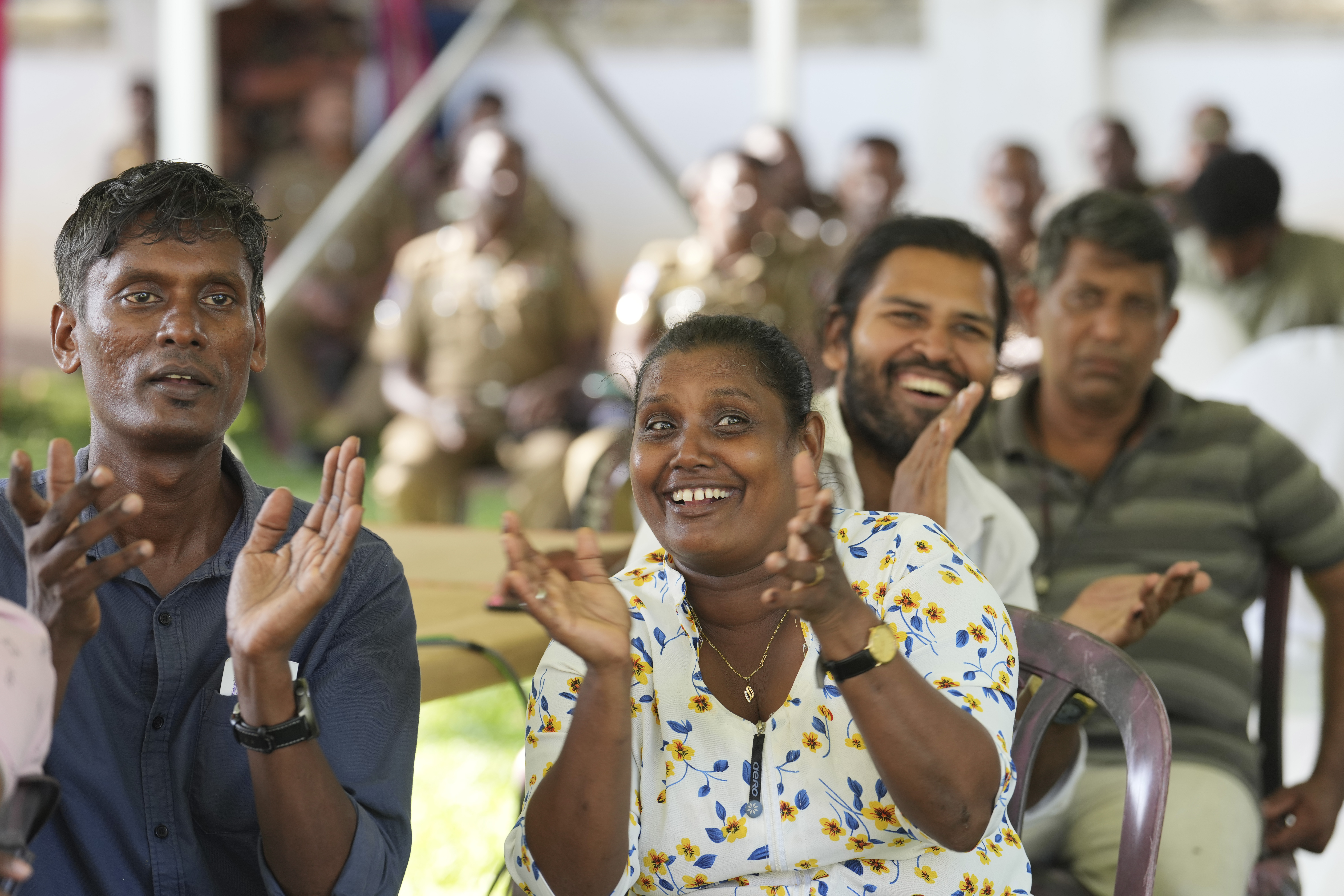 Supporters Marxist lawmaker Anura Kumara Dissanayake cheer as they watch presidential election results on a big electronic screen in Colombo, Sri Lanka, Sunday, Sept. 22, 2024. (AP Photo/Rajesh Kumar Singh)