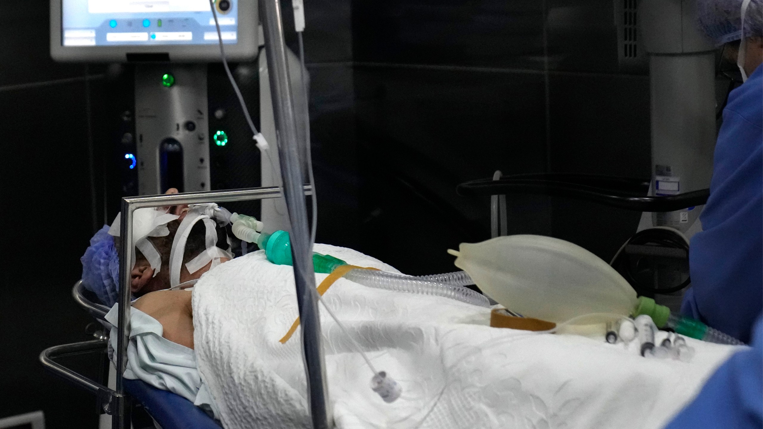 A man who was injured in the explosion of one of the handheld devices, lies inside an operation room ahead of an eye surgery at the Eye Specialist hospital, in Beirut, Lebanon, Friday, Sept. 20, 2024. (AP Photo/Hussein Malla)