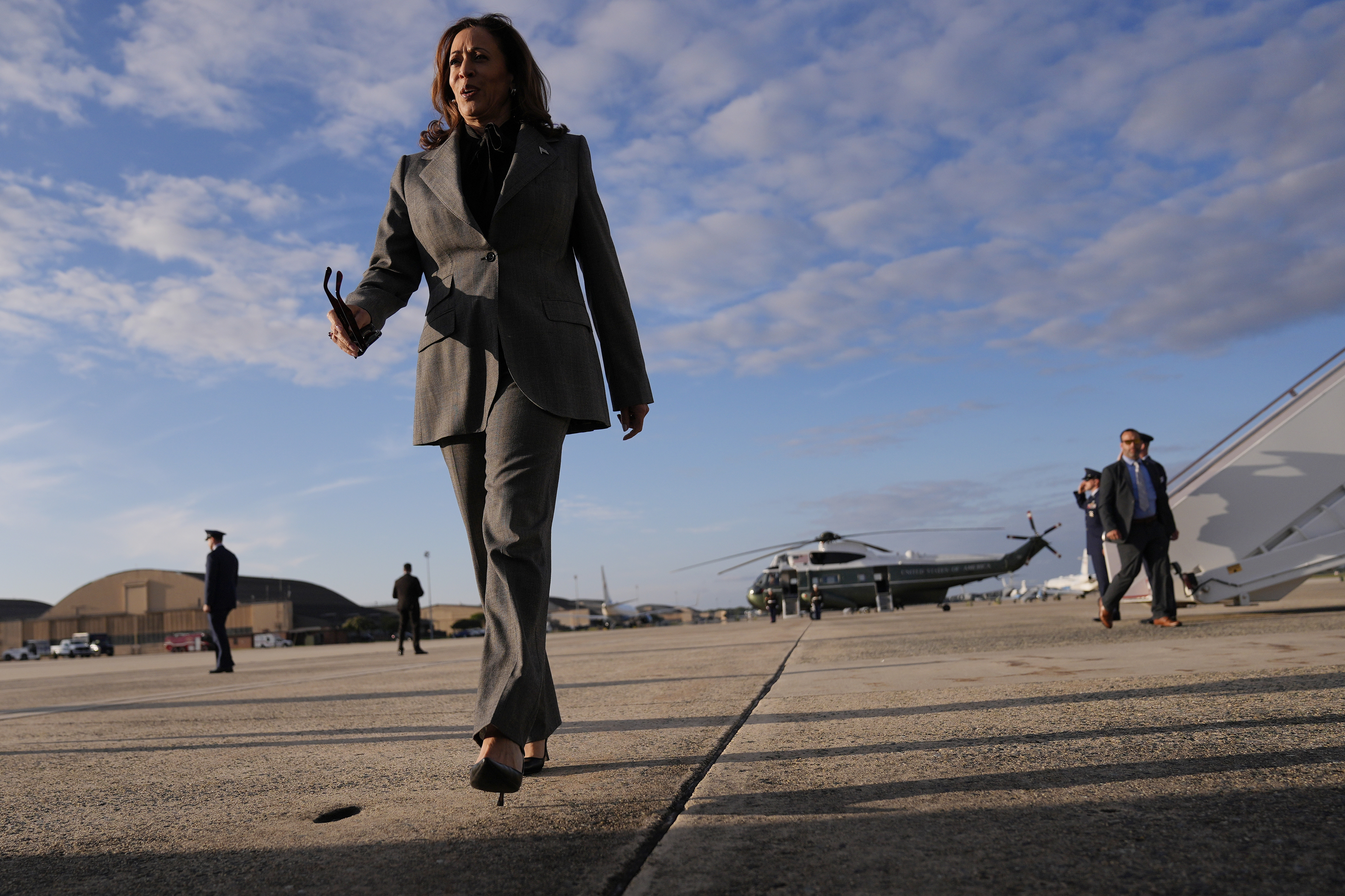 Democratic presidential nominee Vice President Kamala Harris walks over to speak to members of the media upon her arrival at Andrews Air Force Base, Md., Sunday, Sept. 22, 2024. (AP Photo/Matt Rourke/Pool)