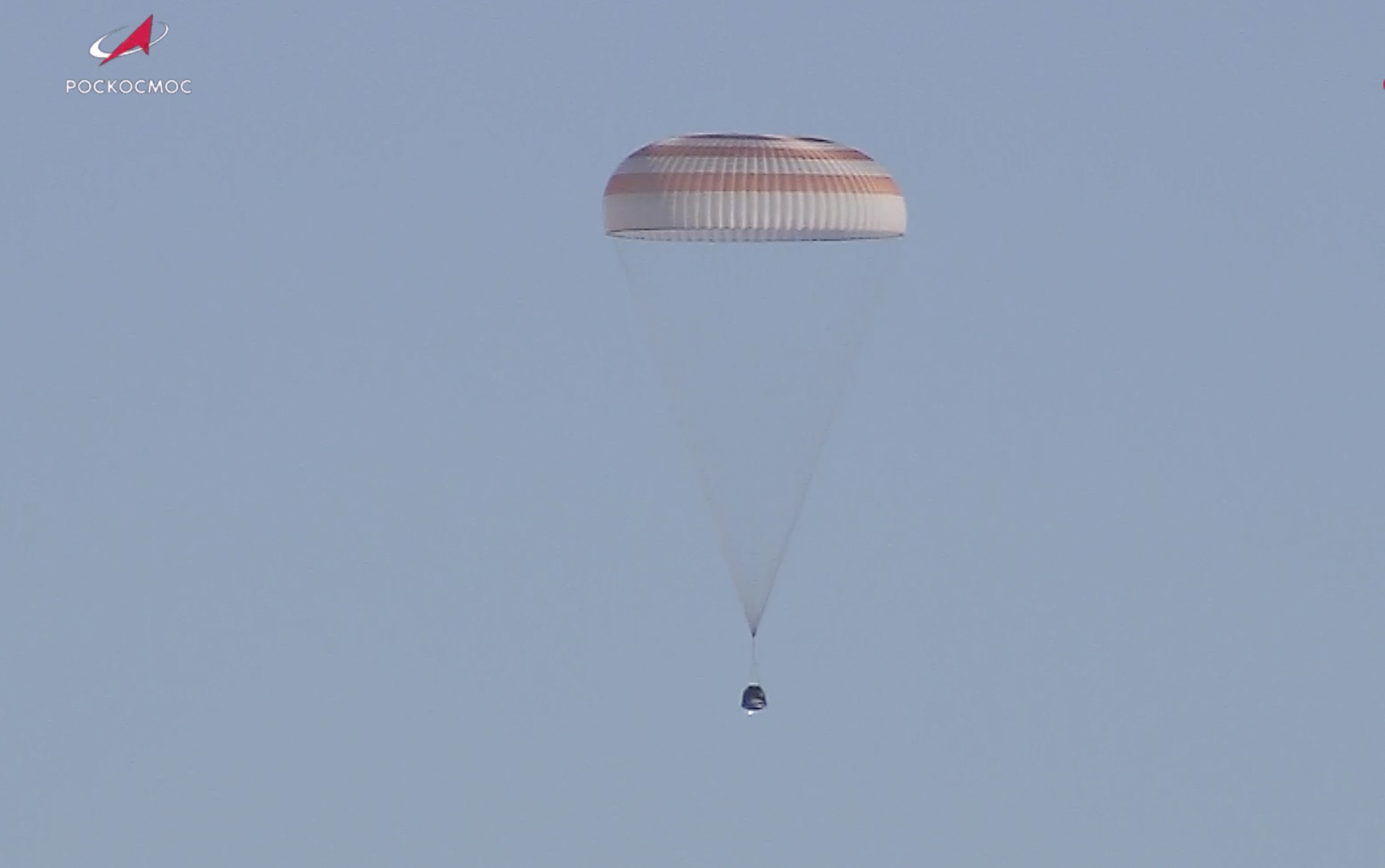 In this photo taken from video released by Roscosmos space corporation, Russian Soyuz MS-25 space capsule carrying the NASA astronaut Tracy Dyson and the Roscosmos cosmonauts Oleg Kononenko and Nikolai Chub descends south-east of the Kazakh town of Zhezkazgan, Kazakhstan, Monday, Sept. 23, 2024. (Roscosmos space corporation via AP)