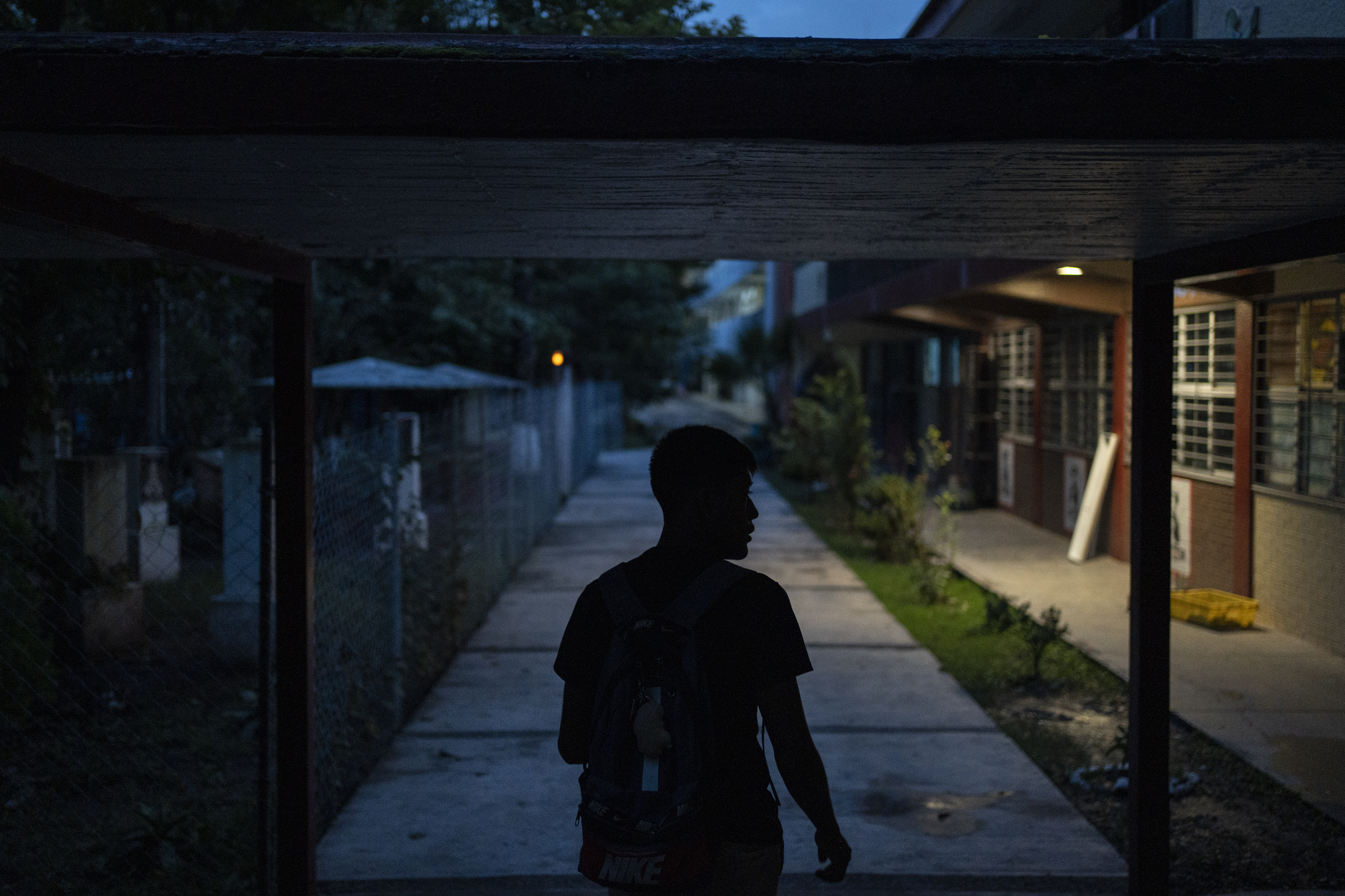 A student walks on the campus of the Raúl Isidro Burgos Rural Normal School in Ayotzinapa, Guerrero state, Mexico, late Sunday, Aug. 25, 2024. (AP Photo/Felix Marquez)