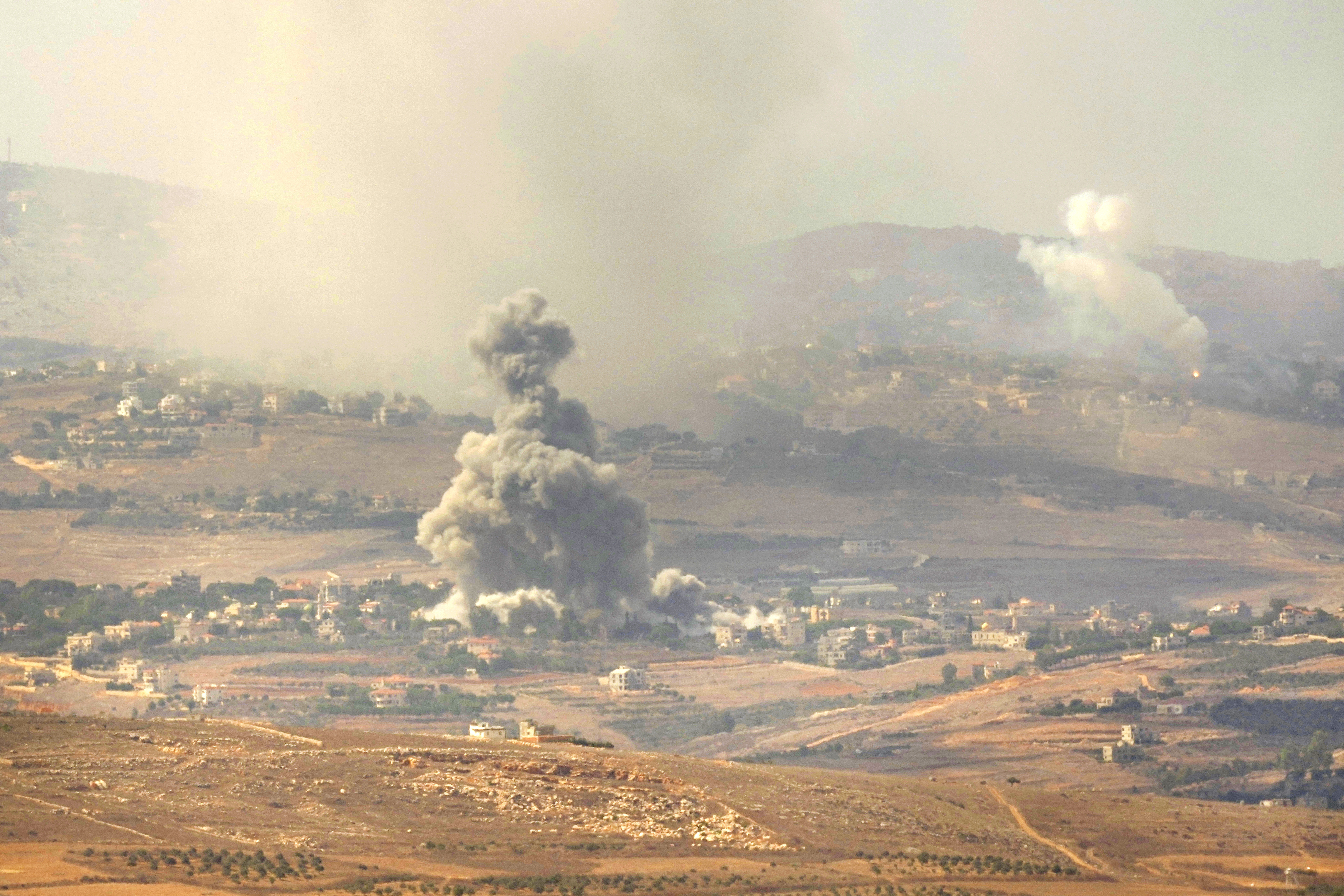 Smoke rises from Israeli airstrikes on villages in the Nabatiyeh district, seen from the southern town of Marjayoun, Lebanon, Monday, Sept. 23, 2024. (AP Photo/Hussein Malla)