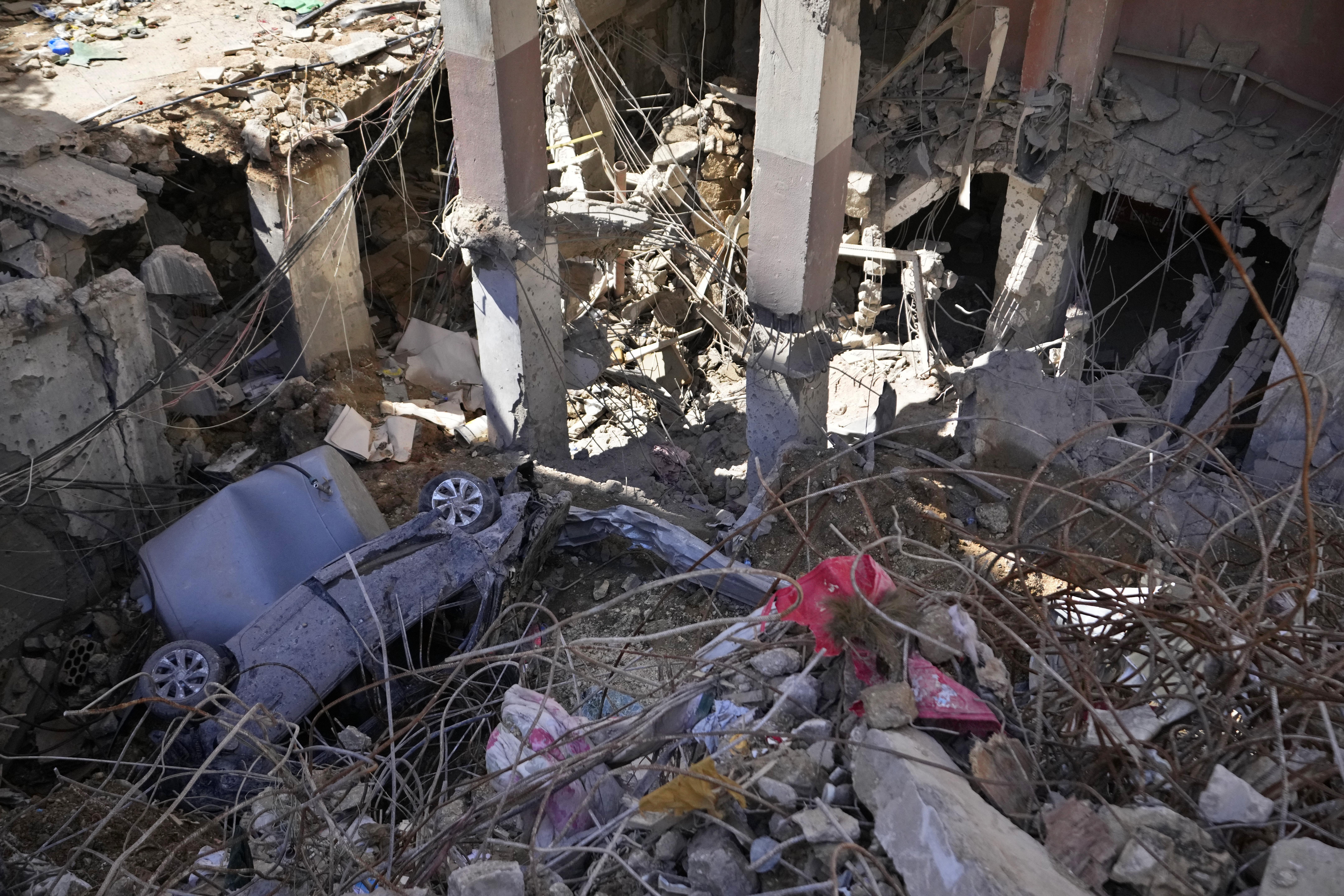 The rubble of a building at the site of Friday's Israeli strike in Beirut's southern suburbs, Lebanon, Monday, Sept. 23, 2024. (AP Photo/Hassan Ammar)