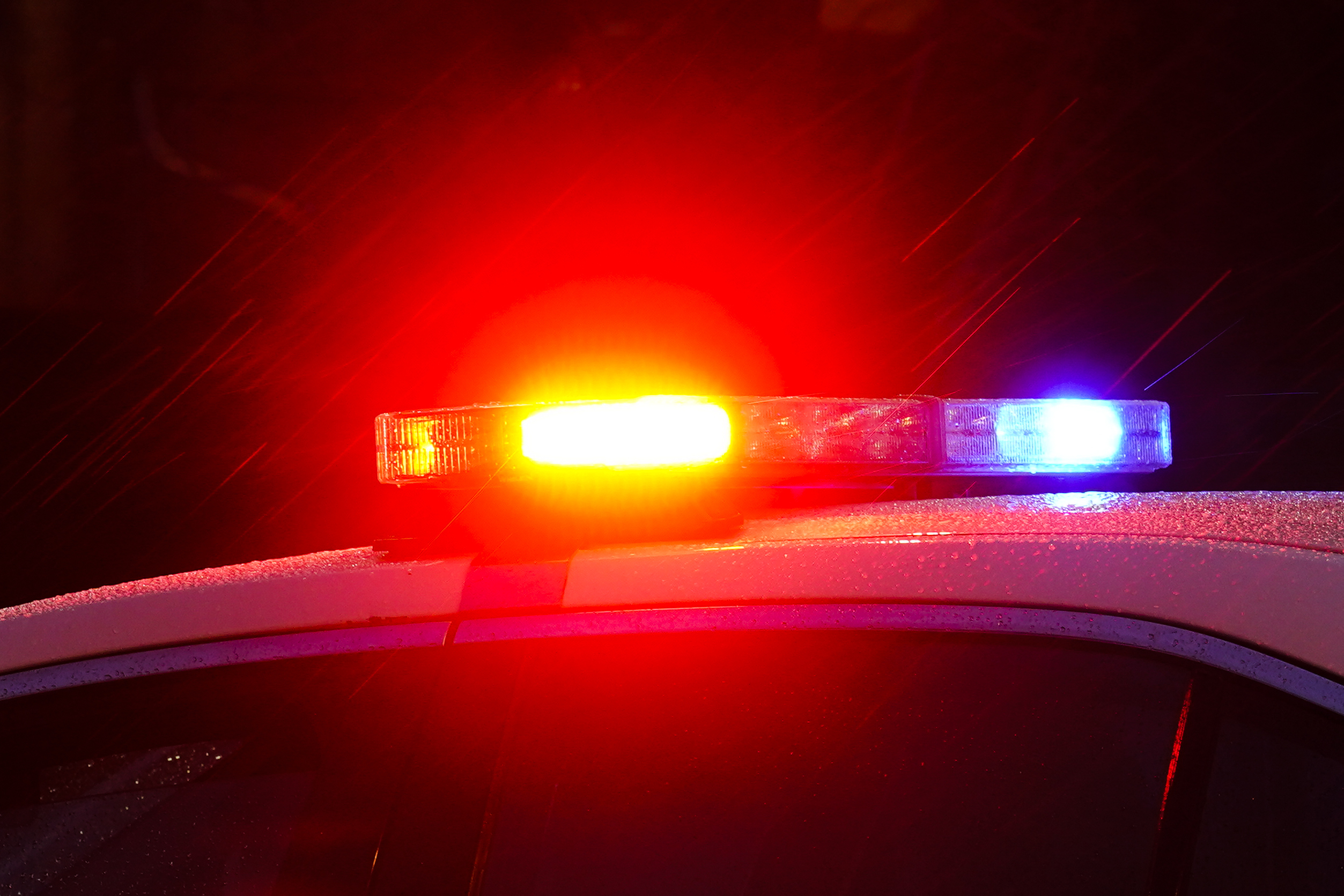 FILE - A police vehicle flashes its lights in Philadelphia, Monday, Jan. 17, 2022. (AP Photo/Matt Rourke, File)