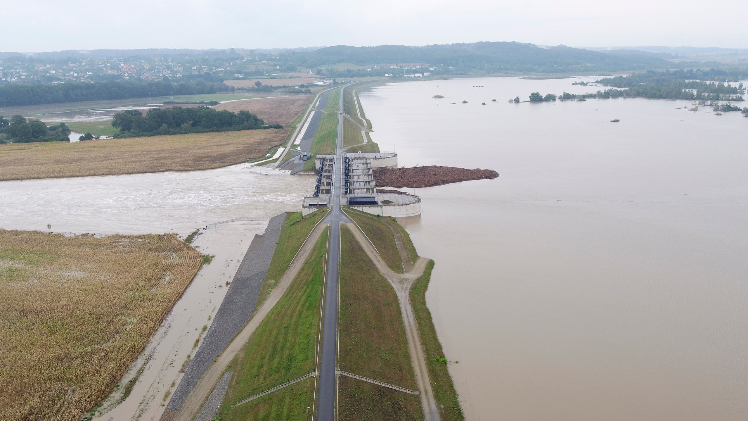 This photo provided by the state company Polish Waters shows the Oder River flood waters channelled into and contained by the newly-built Lower Raciborz Reservoir that has spared the cities of Opole and Wroclaw from flooding, in Raciborz, southwestern Poland, Sept. 16, 2024. (Polish Waters via AP)