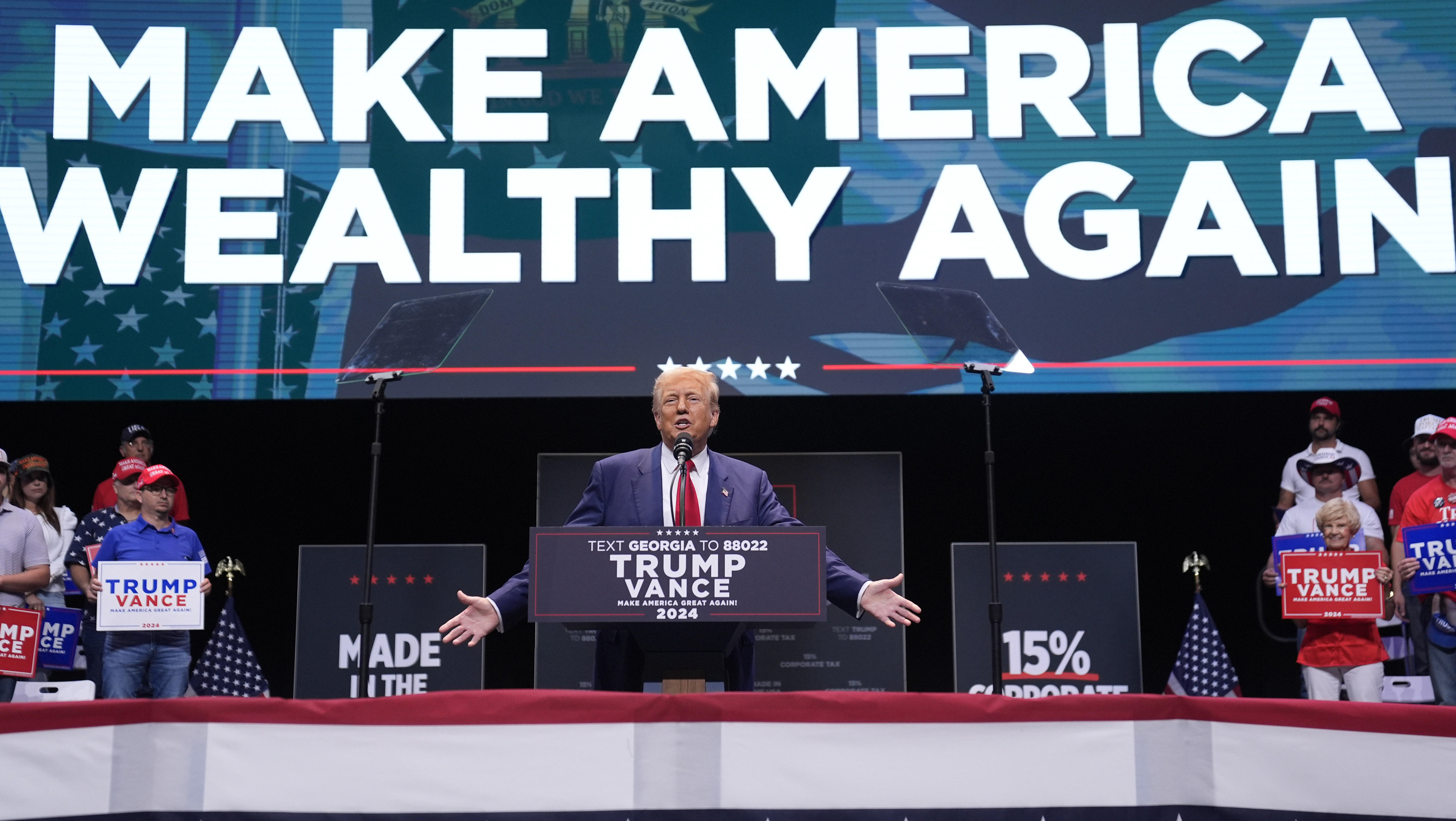 Republican presidential nominee former President Donald Trump speaks about the tax code and manufacturing at the Johnny Mercer Theatre Civic Center, Tuesday, Sept. 24, 2024, in Savannah, Ga. (AP Photo/Evan Vucci)