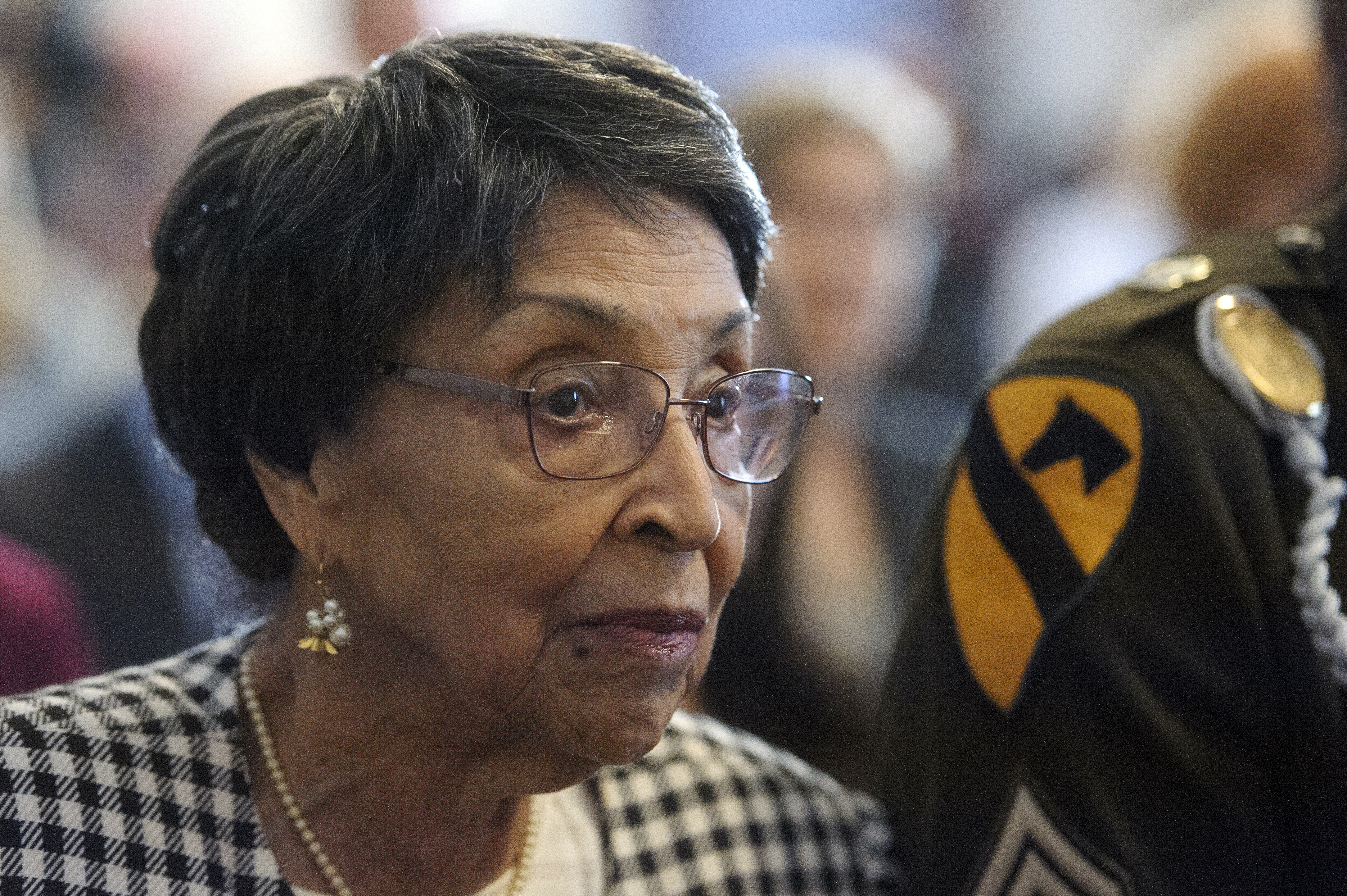 Joann Woodson listens to remarks during a ceremony to posthumously award the Distinguished Service Cross to her husband U.S. Army Staff Sgt. Waverly Woodson Jr., a medic who was part of the only Black combat unit to take part in the D-Day invasion of France during World War II, on Capitol Hill, in Washington, Tuesday, Sept. 24, 2024. (AP Photo/Rod Lamkey, Jr.)