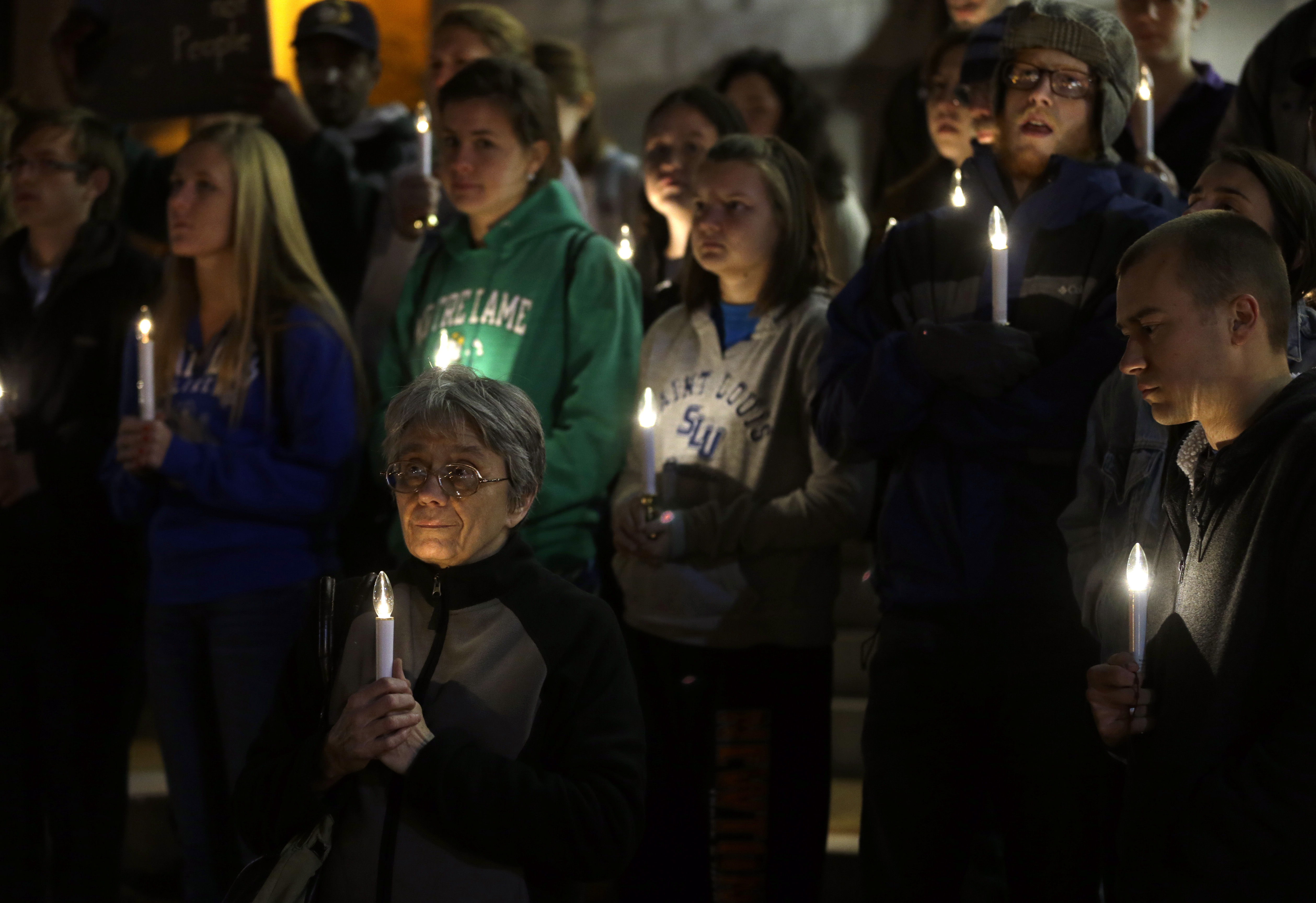 FILE - In this Nov. 19, 2013 file photo, a small group of death penalty opponents stand outside St. Francis Xavier Church during a vigil in protest of the scheduled execution of Missouri death row inmate Joseph Paul Franklin in St. Louis. (AP Photo/Jeff Roberson, File)