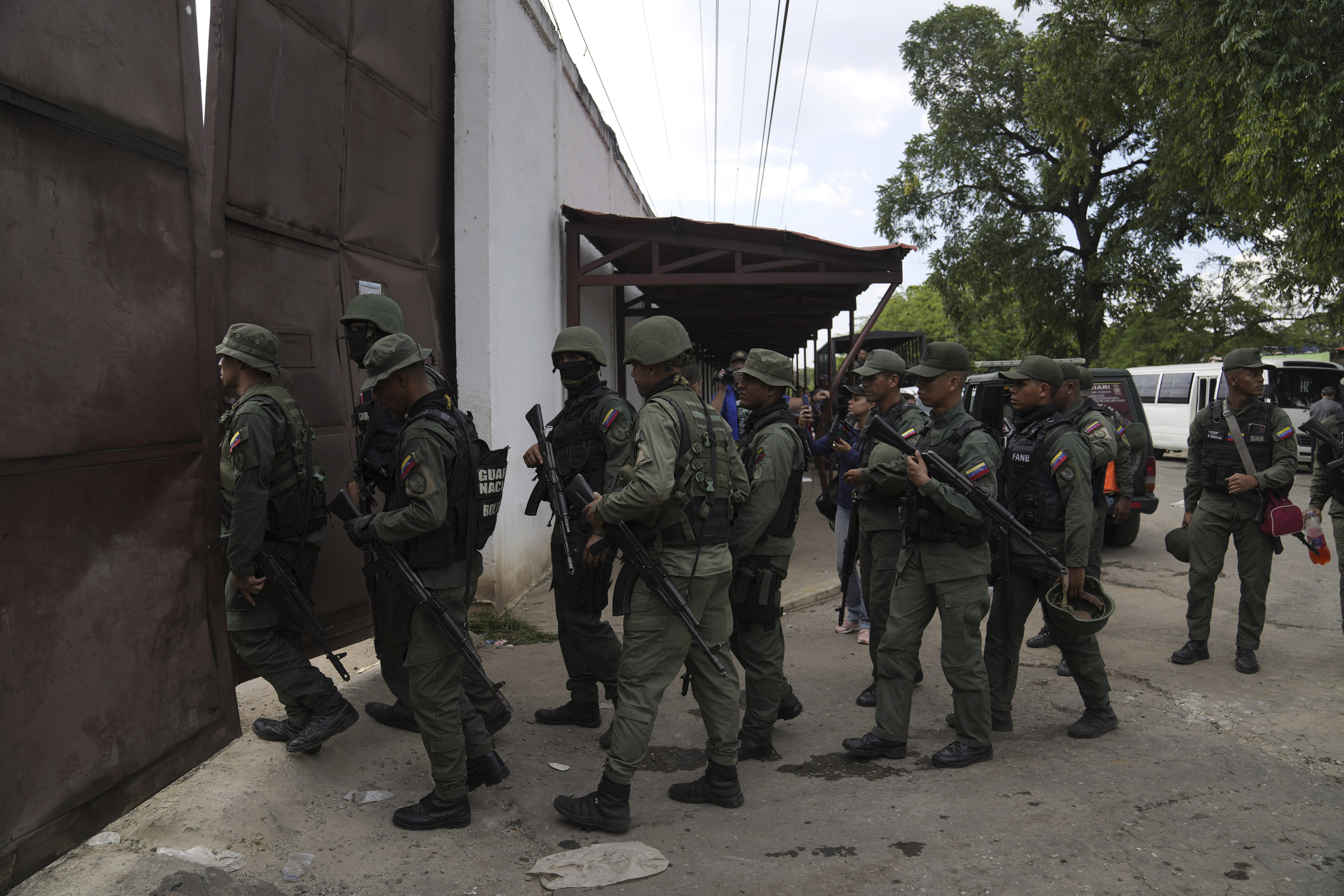 FILE - Soldiers raid the Tocorón Penitentiary Center, in Tocorón, Venezuela, Sept. 20, 2023. The Tren de Aragua gang originated at the prison. (AP Photo/Ariana Cubillos, File)