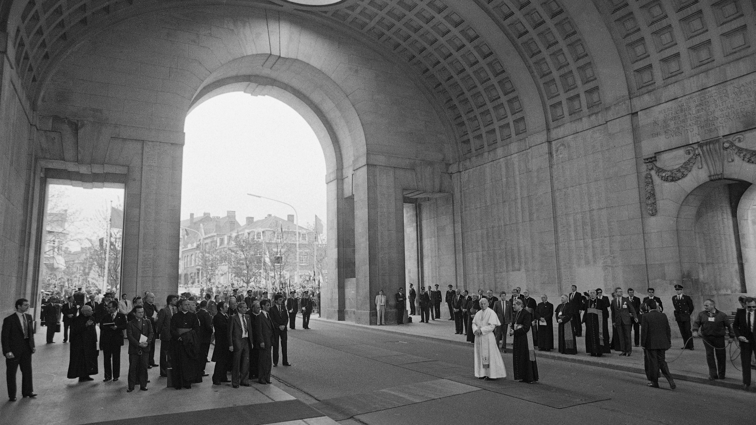 FILE -- Pope John Paul II stands underneath the huge bow of the Menen Gate, a war memorial for the dead of World War II, in Ieper, May 17, 1985, on his second day in Belgium. (AP Photo, File)