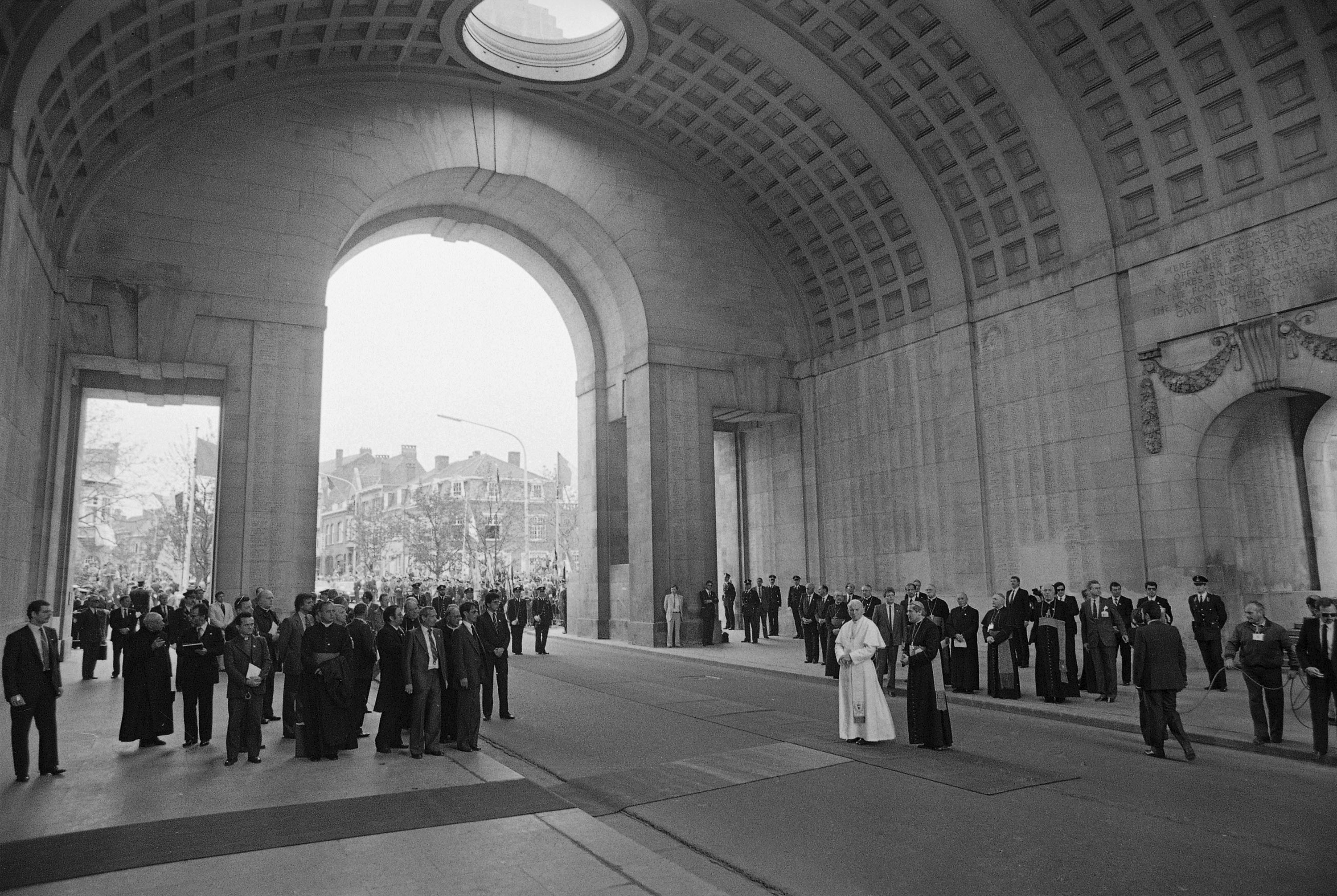 FILE -- Pope John Paul II stands underneath the huge bow of the Menen Gate, a war memorial for the dead of World War II, in Ieper, May 17, 1985, on his second day in Belgium. (AP Photo, File)