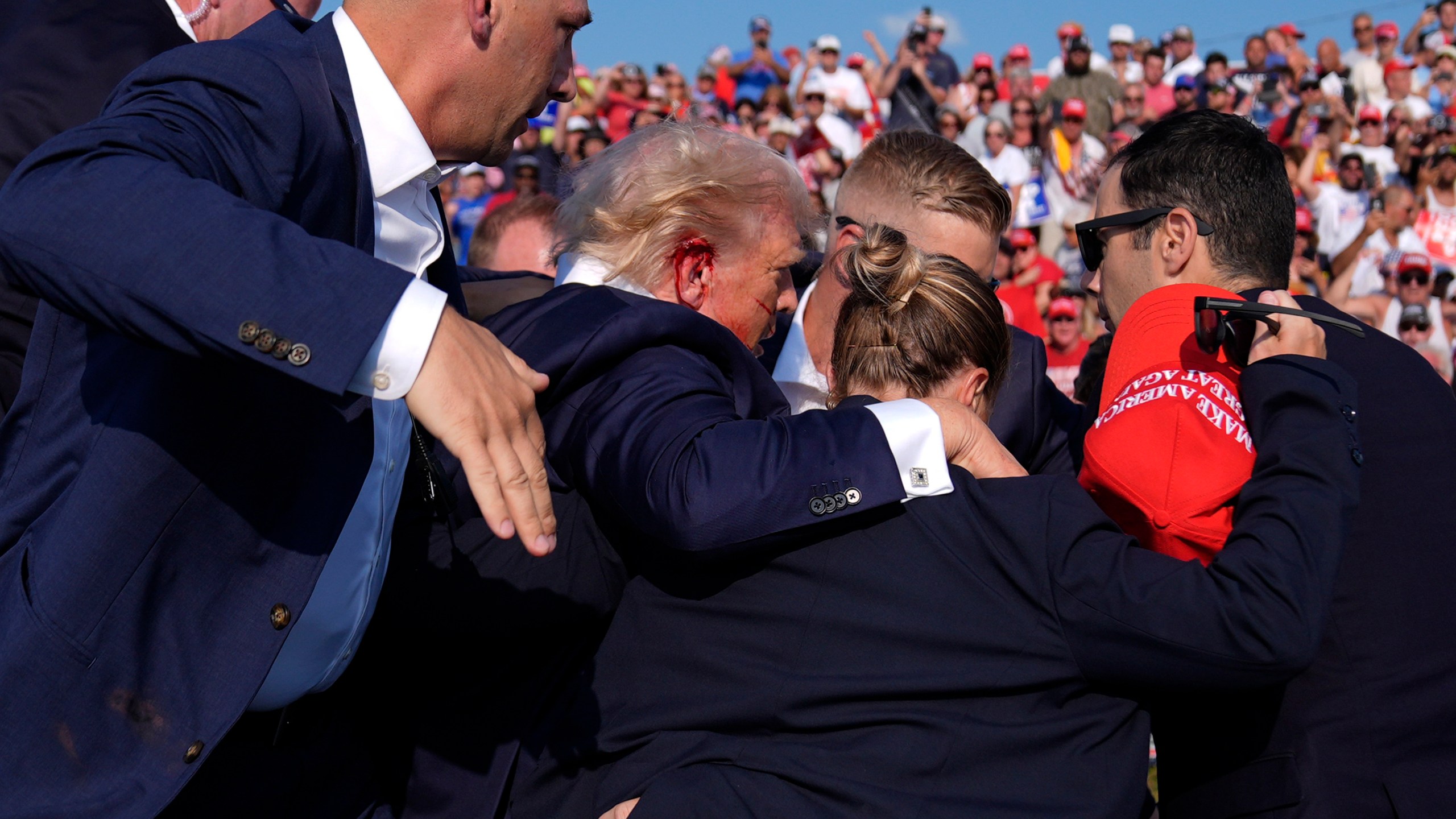 FILE - Republican presidential candidate former President Donald Trump is surrounded by U.S. Secret Service agents at a campaign rally, July 13, 2024, in Butler, Pa. (AP Photo/Evan Vucci, File)