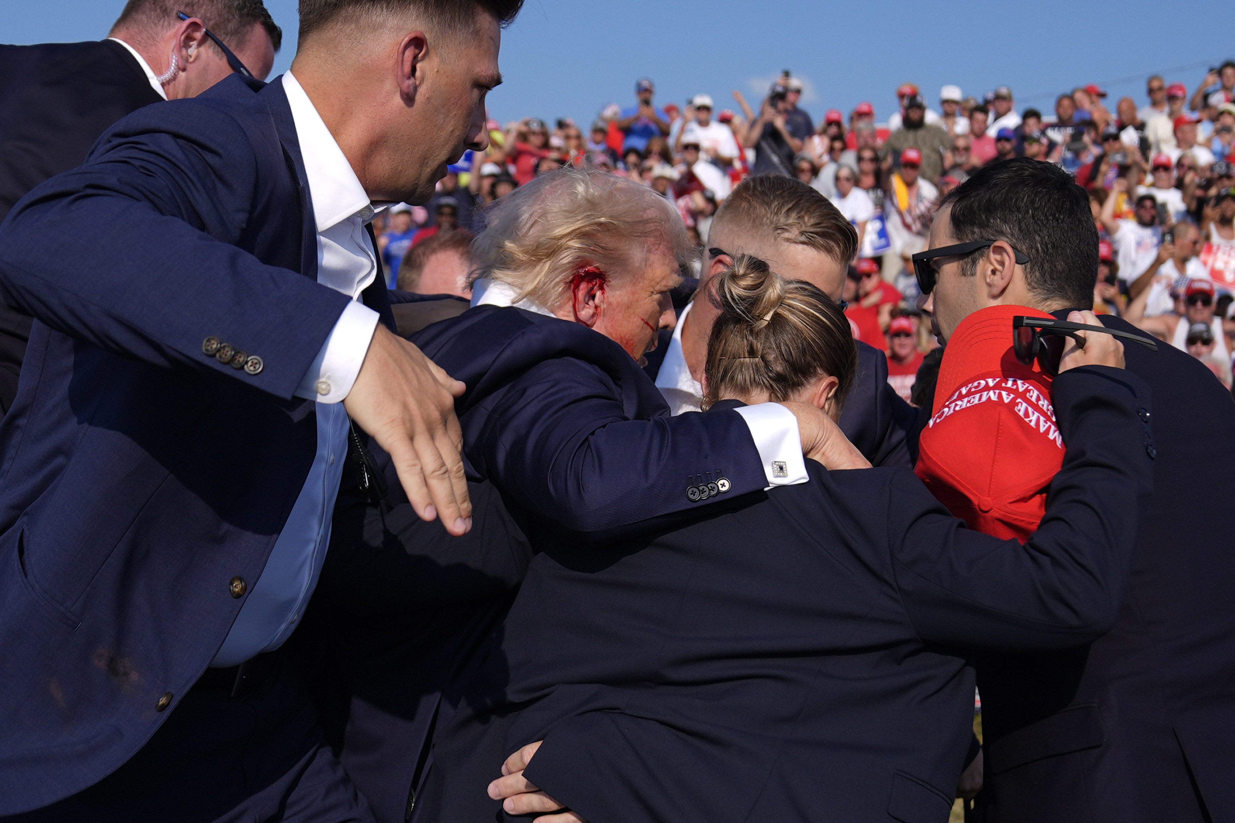 FILE - Republican presidential candidate former President Donald Trump is surrounded by U.S. Secret Service agents at a campaign rally, July 13, 2024, in Butler, Pa. (AP Photo/Evan Vucci, File)