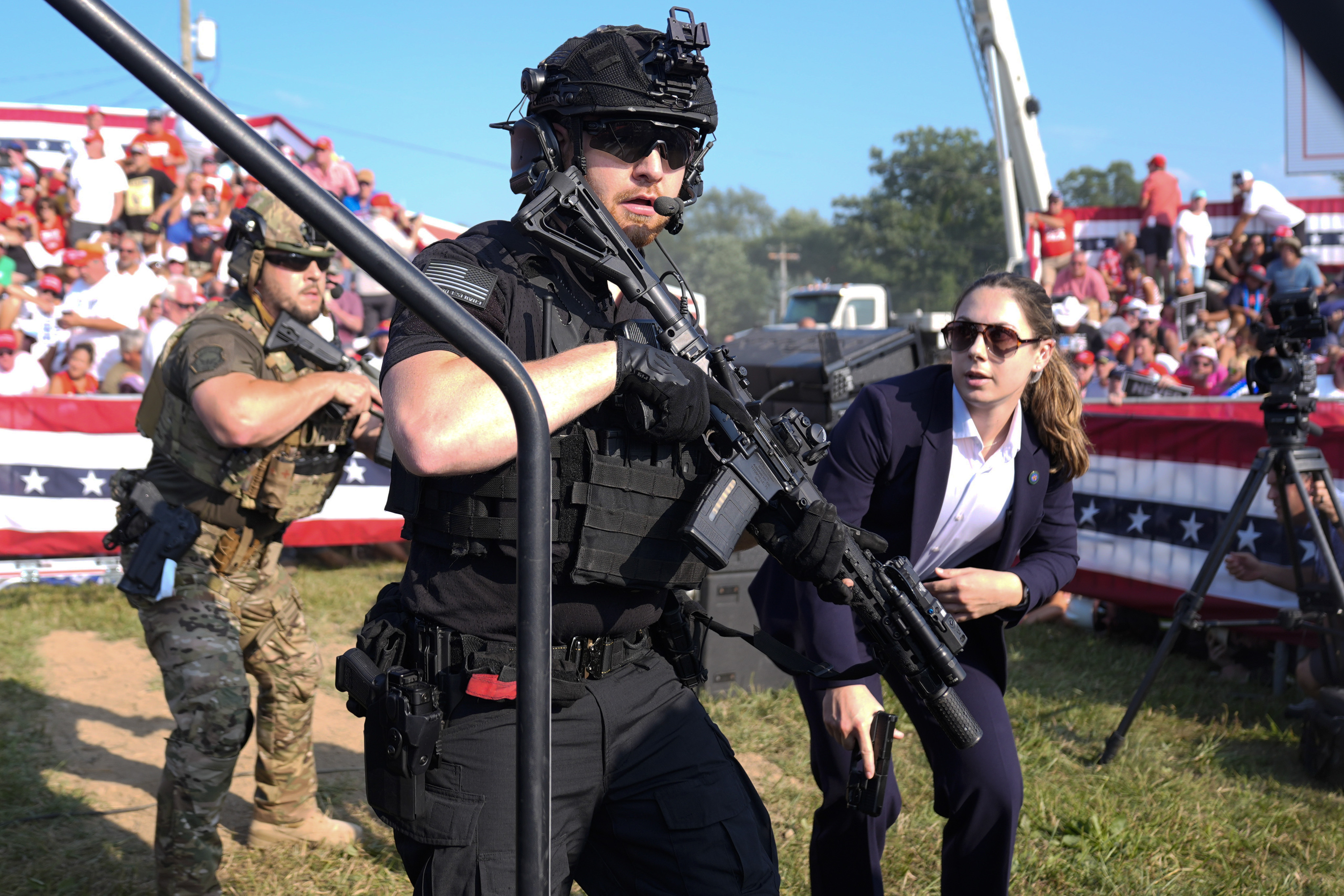 FILE - U.S. Secret Service agents respond as Republican presidential candidate former President Donald Trump is surrounded on stage by U.S. Secret Service agents at a campaign rally, July 13, 2024, in Butler, Pa. (AP Photo/Evan Vucci, File)