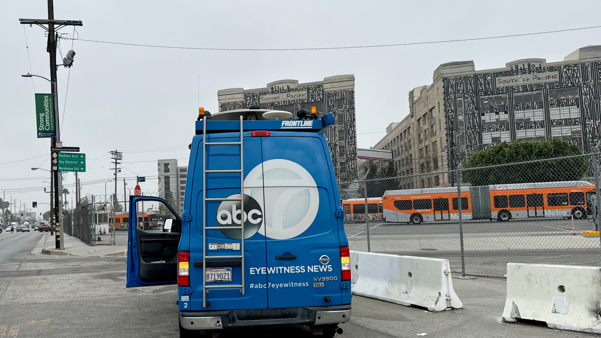 A news truck is parked near the scene of an overnight transit bus hijacking Wednesday, Sept. 25, 2024, in Los Angeles. (AP Photo/Ryan Sun)