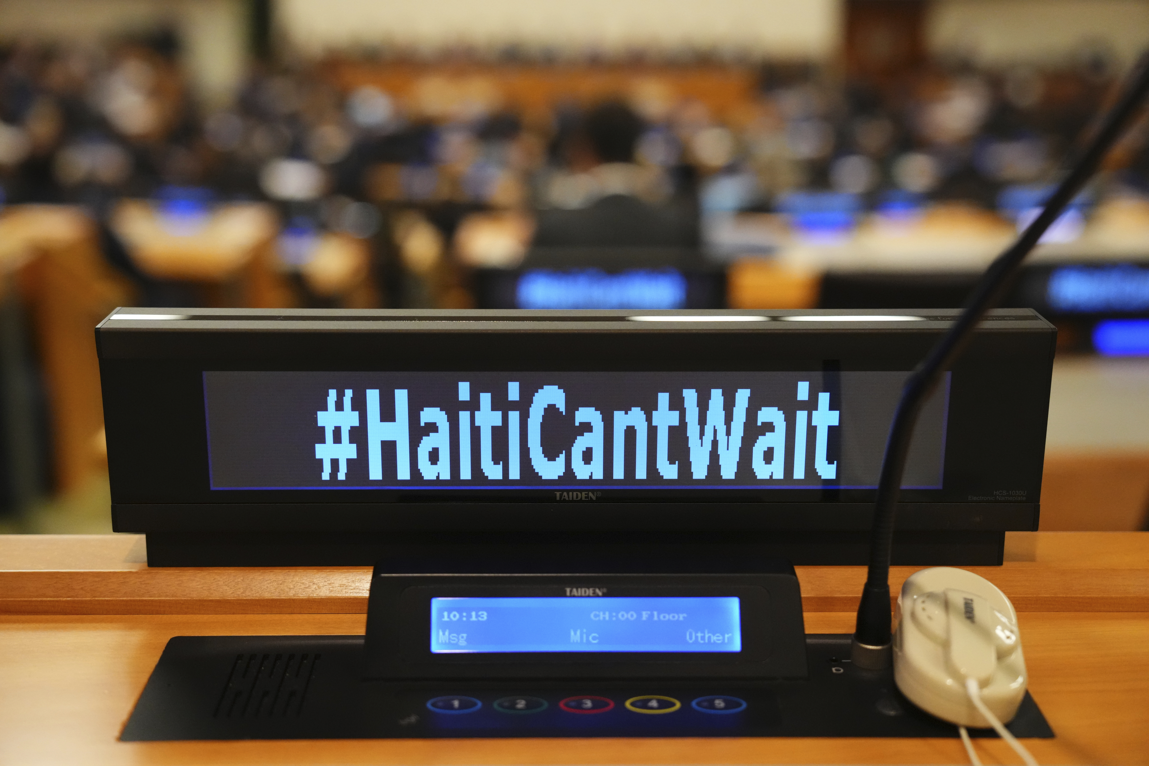 The social media slogan #HaitiCantWait is displayed as Canada Prime Minister Justin Trudeau takes part in high level meeting with an advisory group on Haiti at the United Nations headquarters on Monday, Sept. 23, 2024. (Sean Kilpatrick/The Canadian Press via AP)