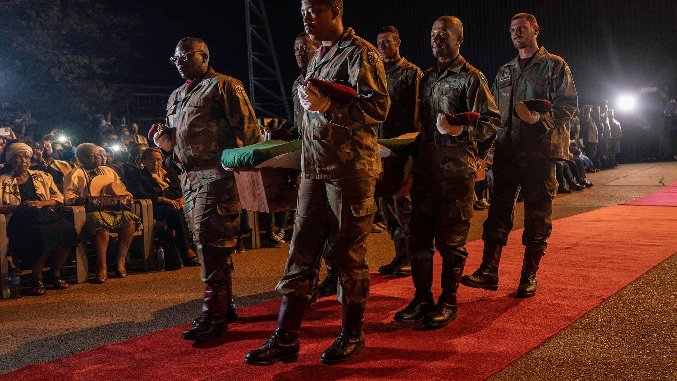 One of the remains of South Africans who died while exiled in Zimbabwe and Zambia during the struggle against white minority rule arrive at the Waterkloof Air Force Base in Pretoria, South Africa, Wednesday, Sept. 25, 2024. (AP Photo/Shiraaz Mohamed)