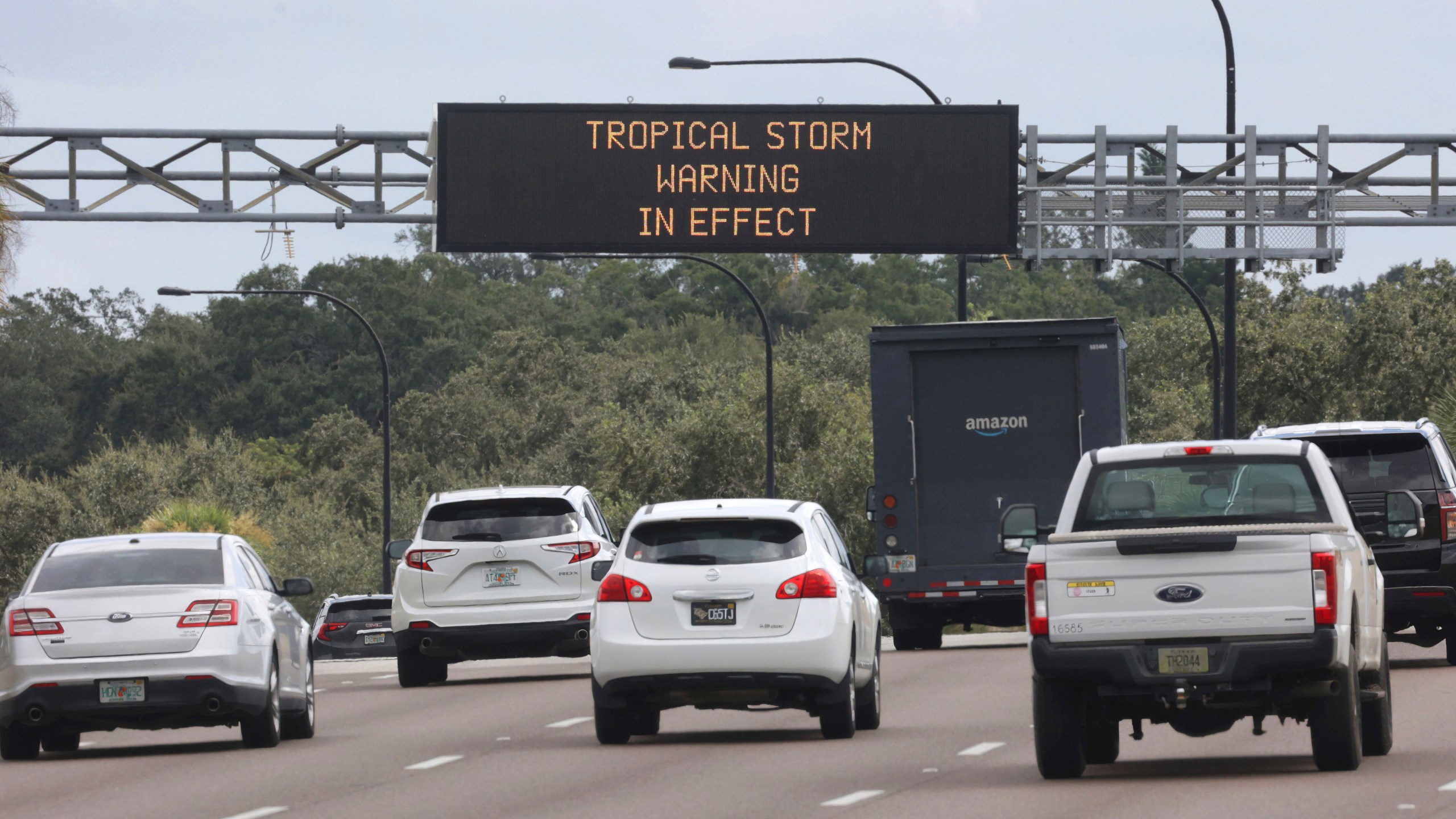 A traffic advisory sign on westbound S.R. 408 near downtown Orlando, Fla., informs commuters of the approaching Hurricane Helene, Wednesday, Sept. 25, 2024. (Joe Burbank/Orlando Sentinel via AP)