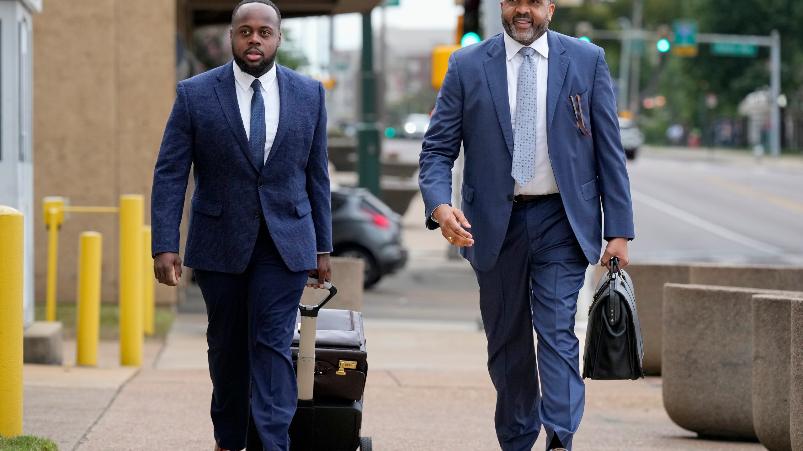 Former Memphis police officer Tadarrius Bean, left, arrives at the federal courthouse with his attorney John Keith Perry, right, for the day's proceedings during the trial in the Tyre Nichols case Wednesday, Sept. 25, 2024, in Memphis, Tenn. (AP Photo/George Walker IV)