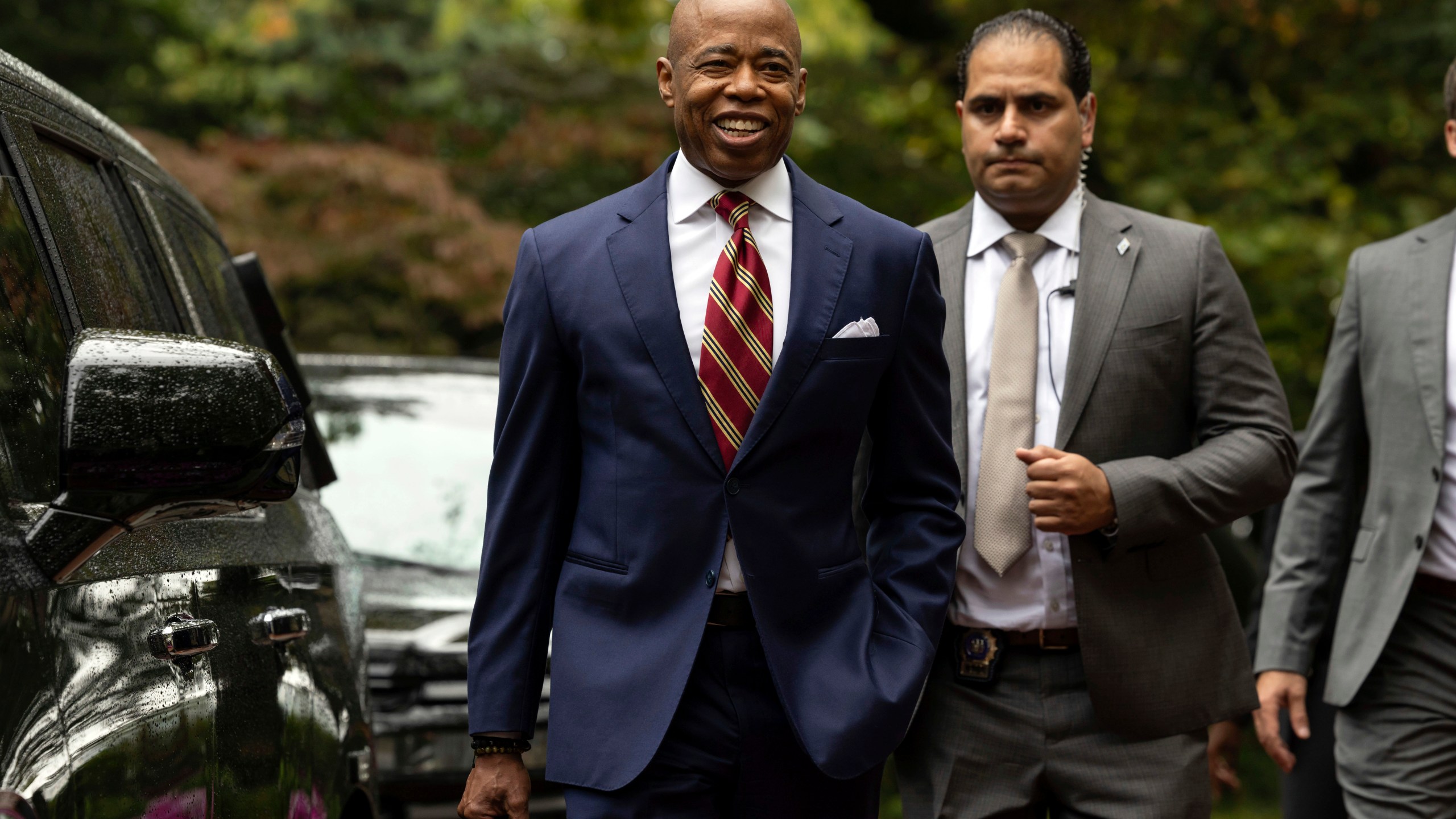 New York City Mayor Eric Adams, left, exits Gracie Mansion, the official residence of the mayor, Thursday, Sept. 26, 2024, in New York. (AP Photo/Yuki Iwamura)