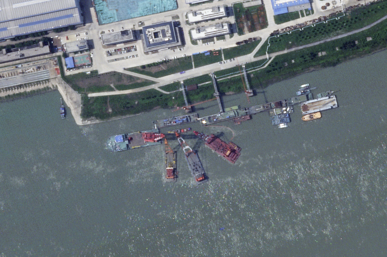 This satellite image from Planet Labs PBC shows what appears to be a sunken Chinese submarine at a shipyard near Wuhan, China, June 15, 2024. (Planet Labs PBC via AP)